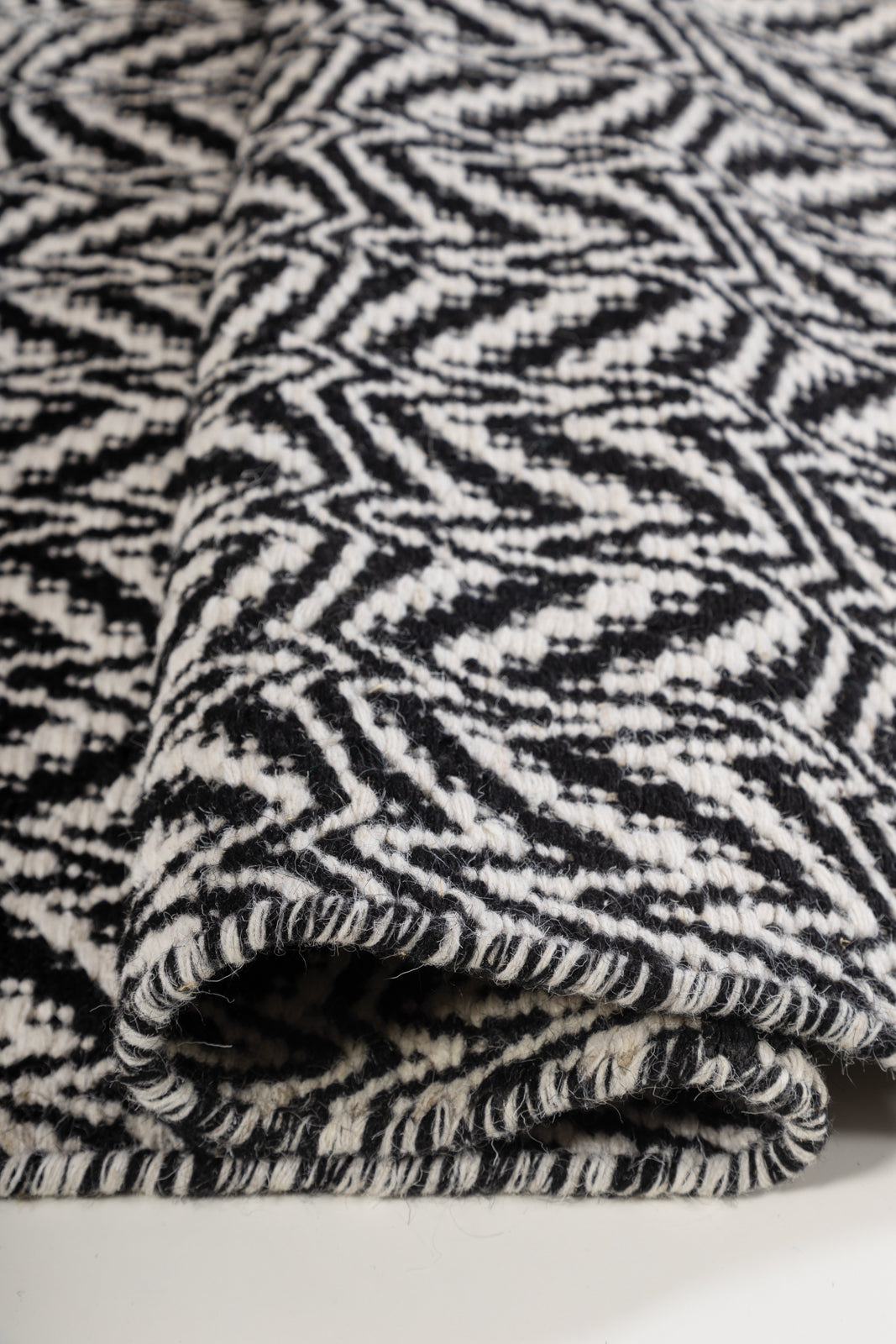 Loomline Wool Rug detail of the striped wool surface and edge finishing