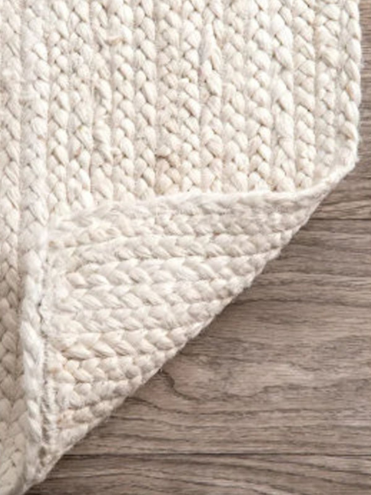 Lusaka natural jute braided area rug-Ivory detail showing the textured jute surface and finishing