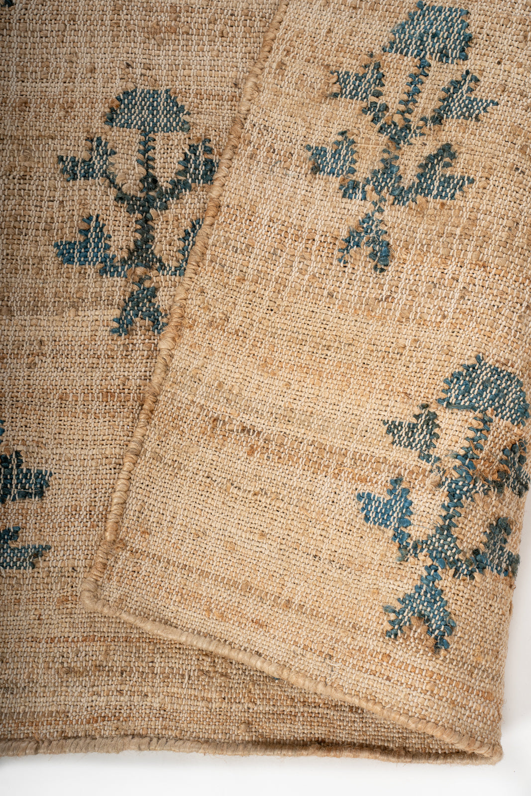 Meadow Bloom Jute Rug detail of the floral motif in jute cut pile