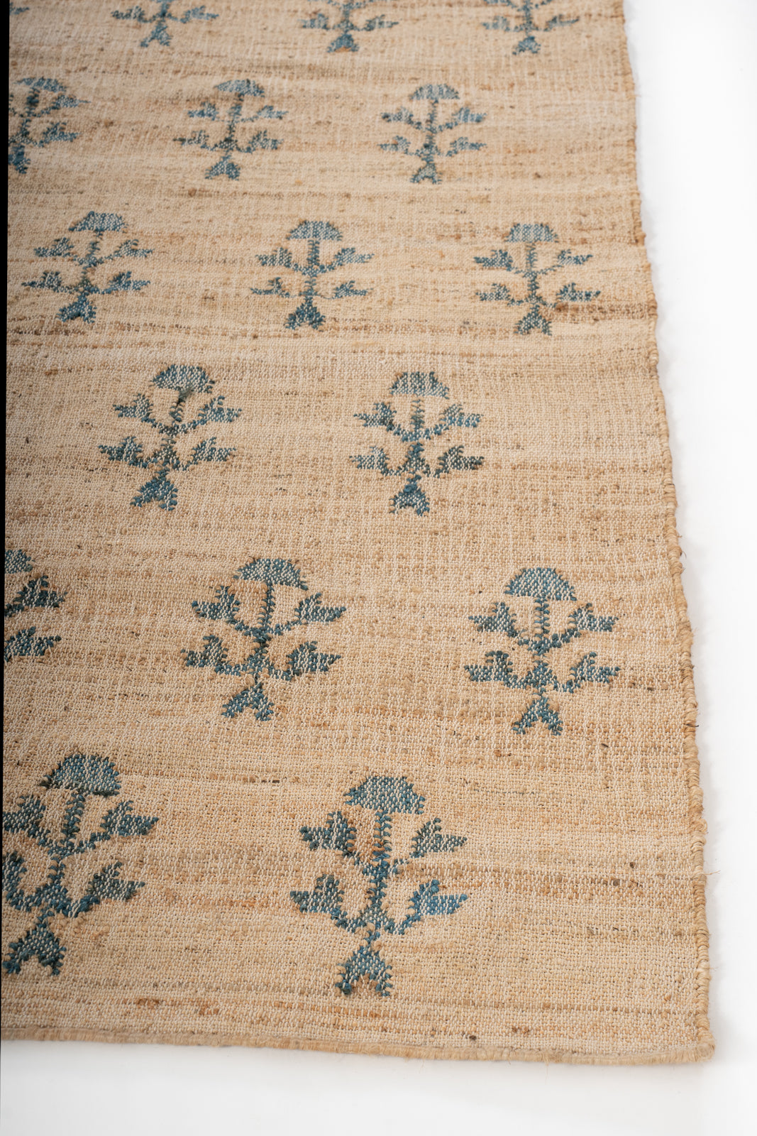 Meadow Bloom Jute Rug jute rug styled in a living room interior