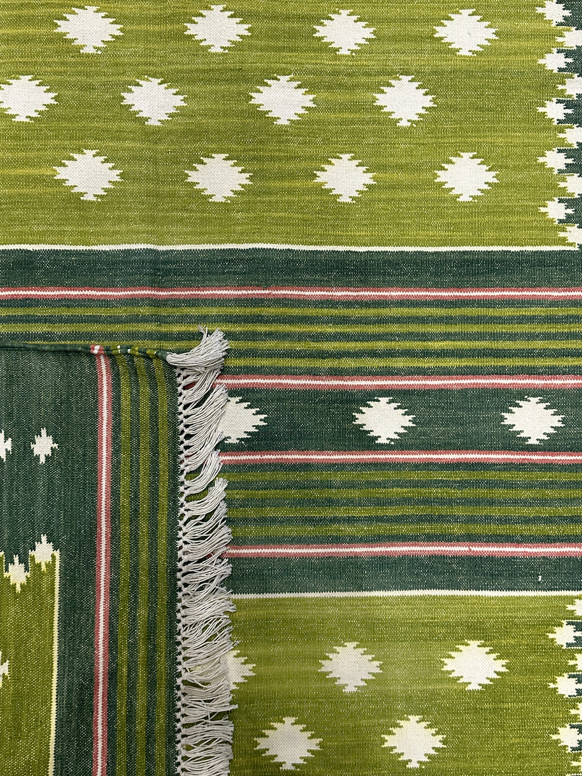 Meadow Essence Flatweave Rug close-up showing the cotton pile and floral motif