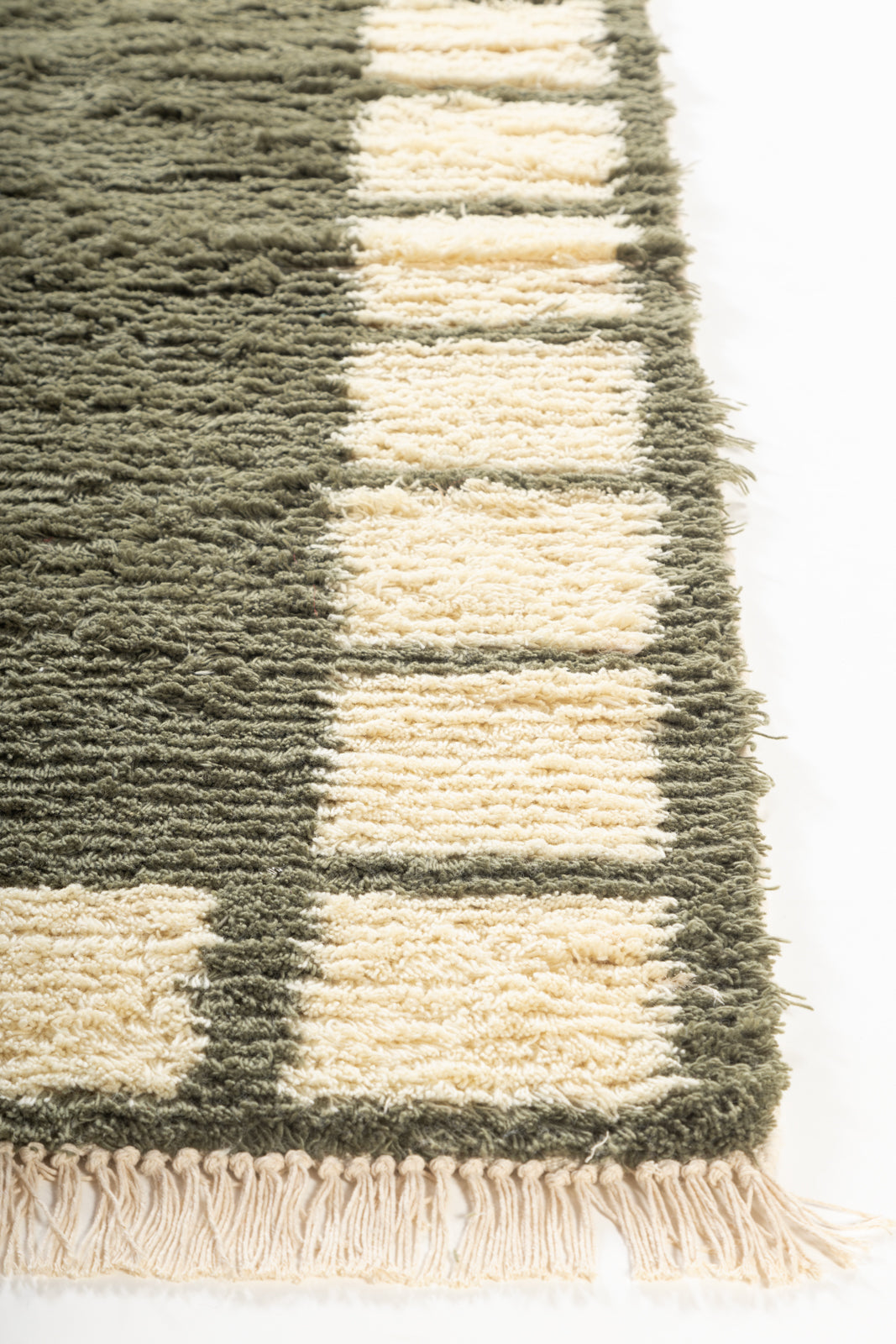 Meadow Frame Wool Rug wool rug styled in a living room interior