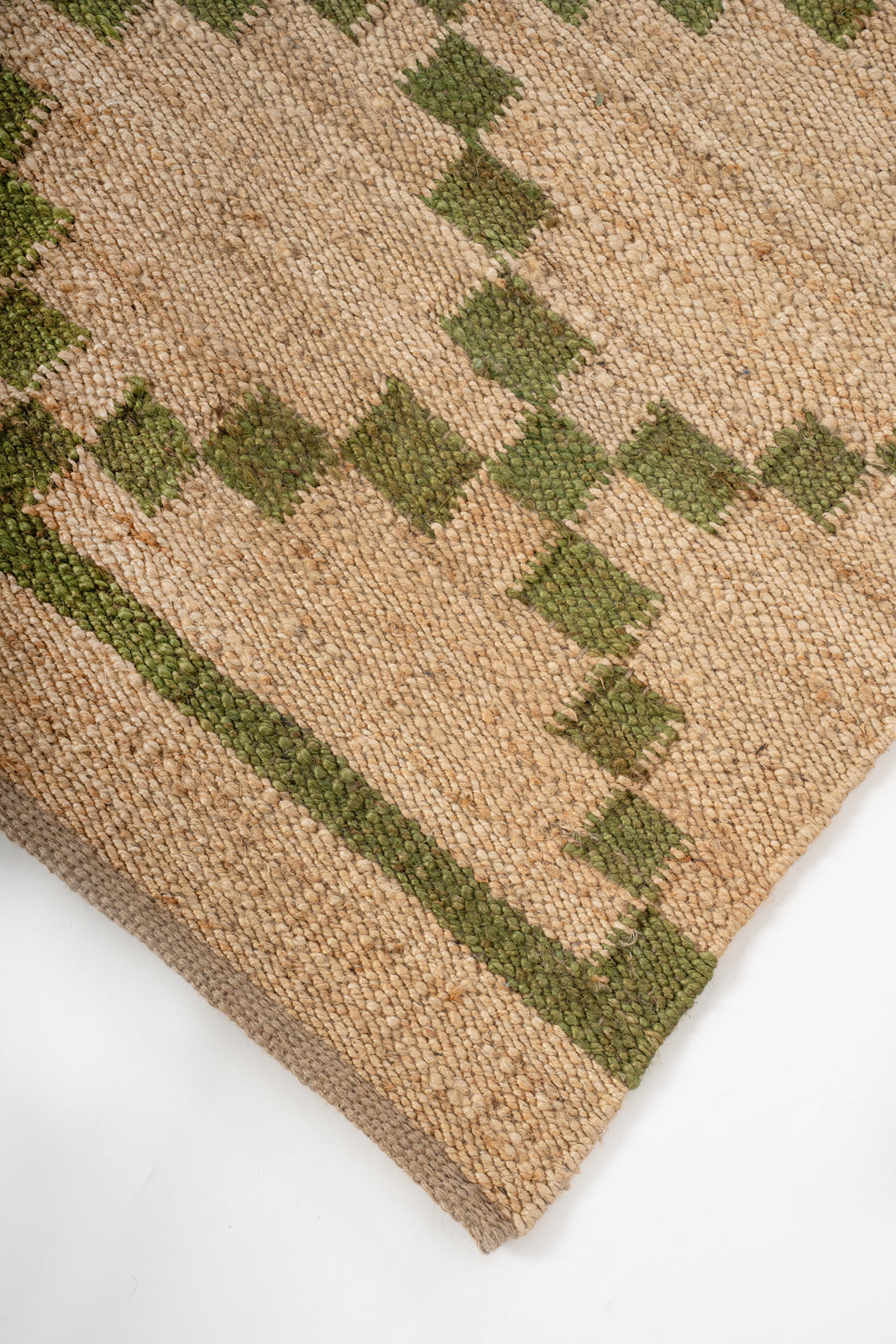 Meadow Jute Rug close-up showing the jute pile and floral motif