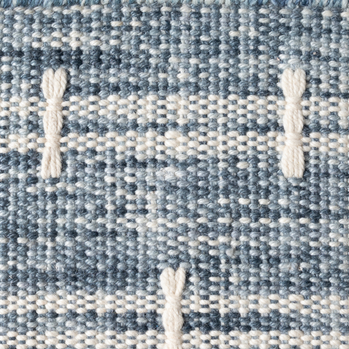 Meridian Loom : Starlight Tide close-up showing the wool weave and geometric motif
