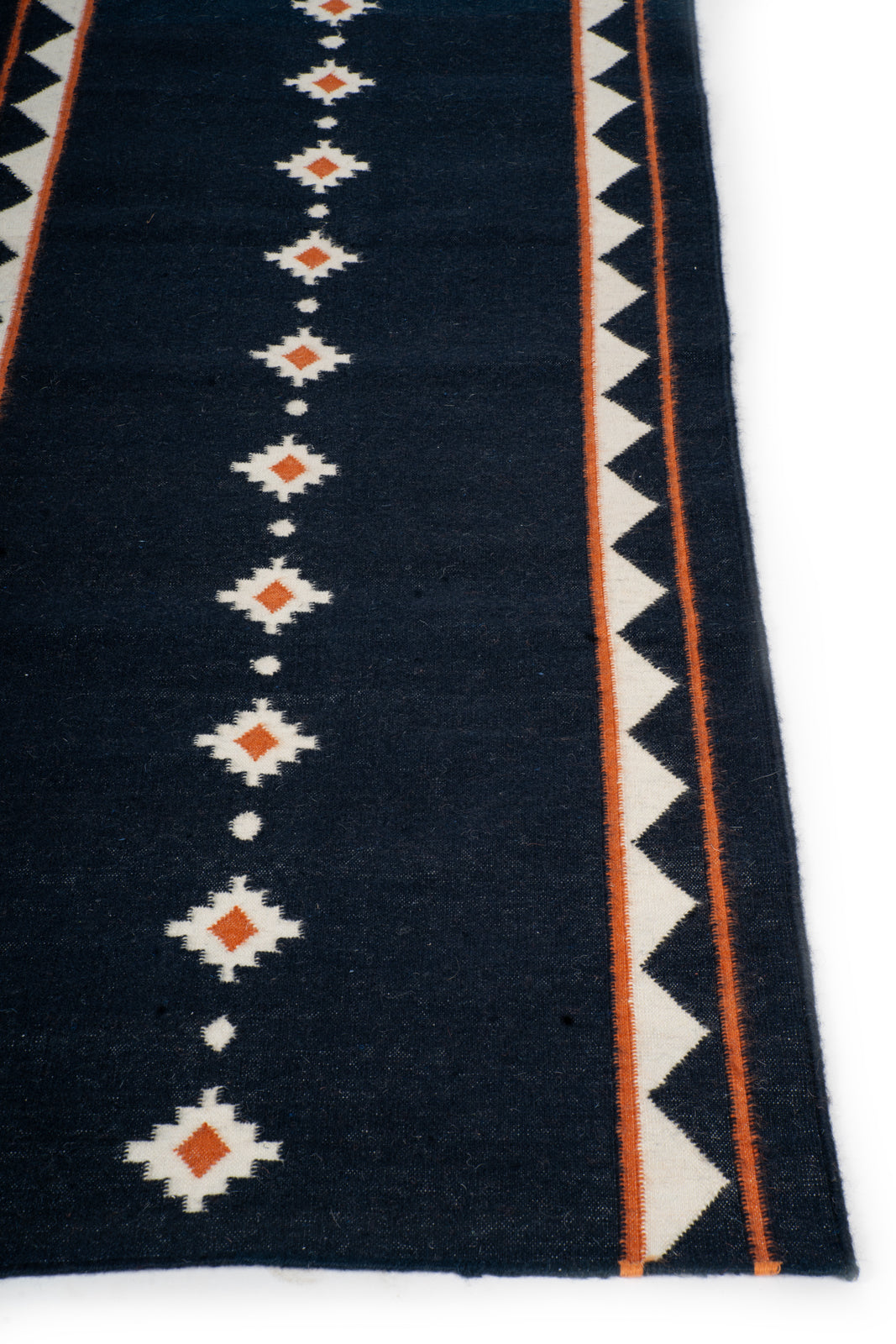 Midnight Ember Dhurrie Runner - cotton runner laid in a hallway view