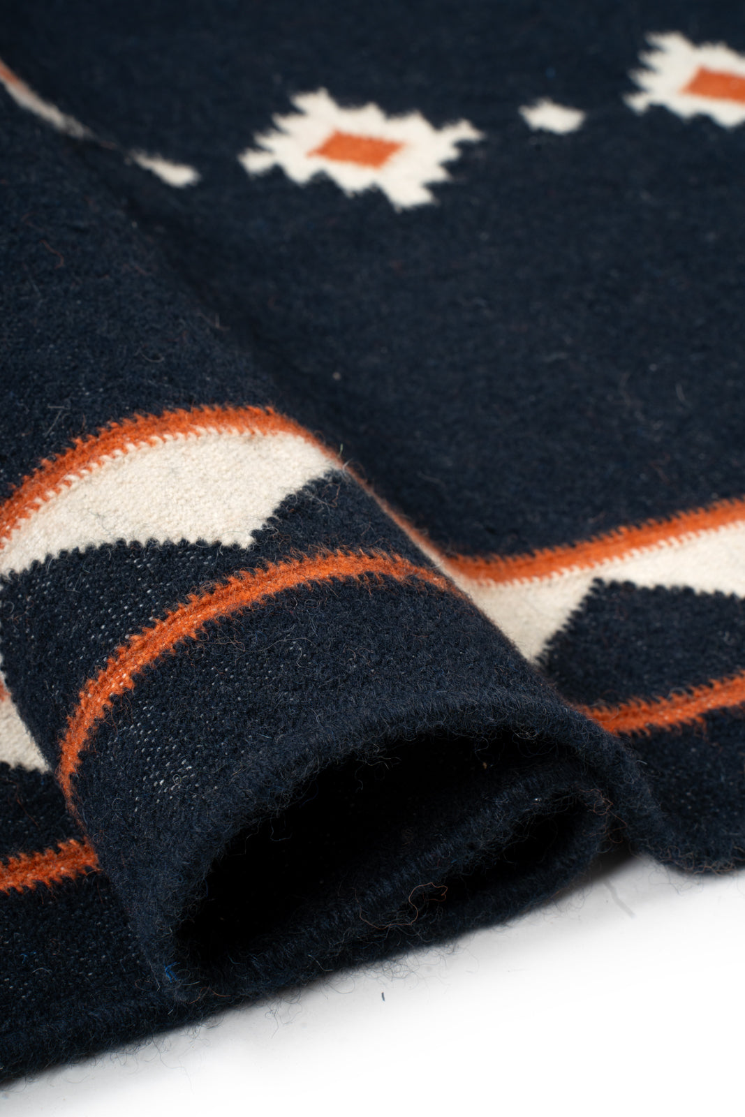 Midnight Ember Dhurrie Runner - cotton runner laid in a hallway view