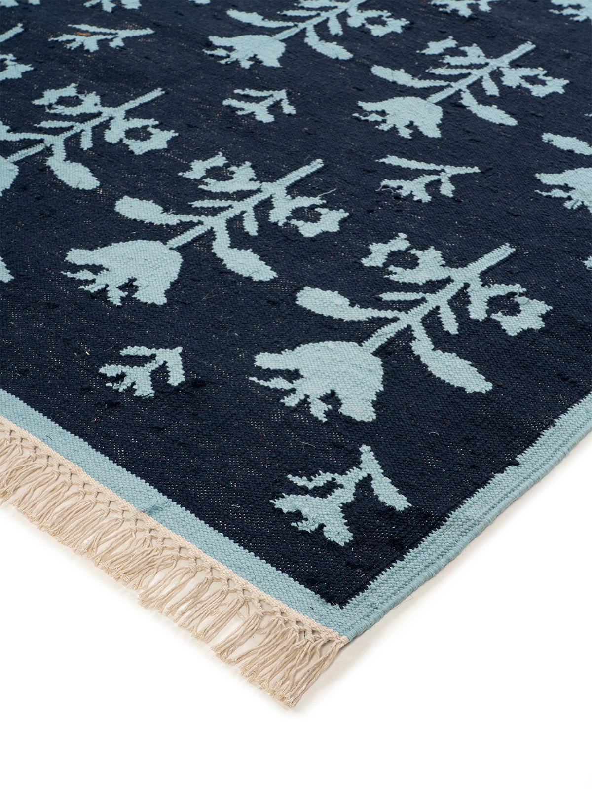Midnight Tulip Flatweave Rug close-up showing the wool pile and floral motif