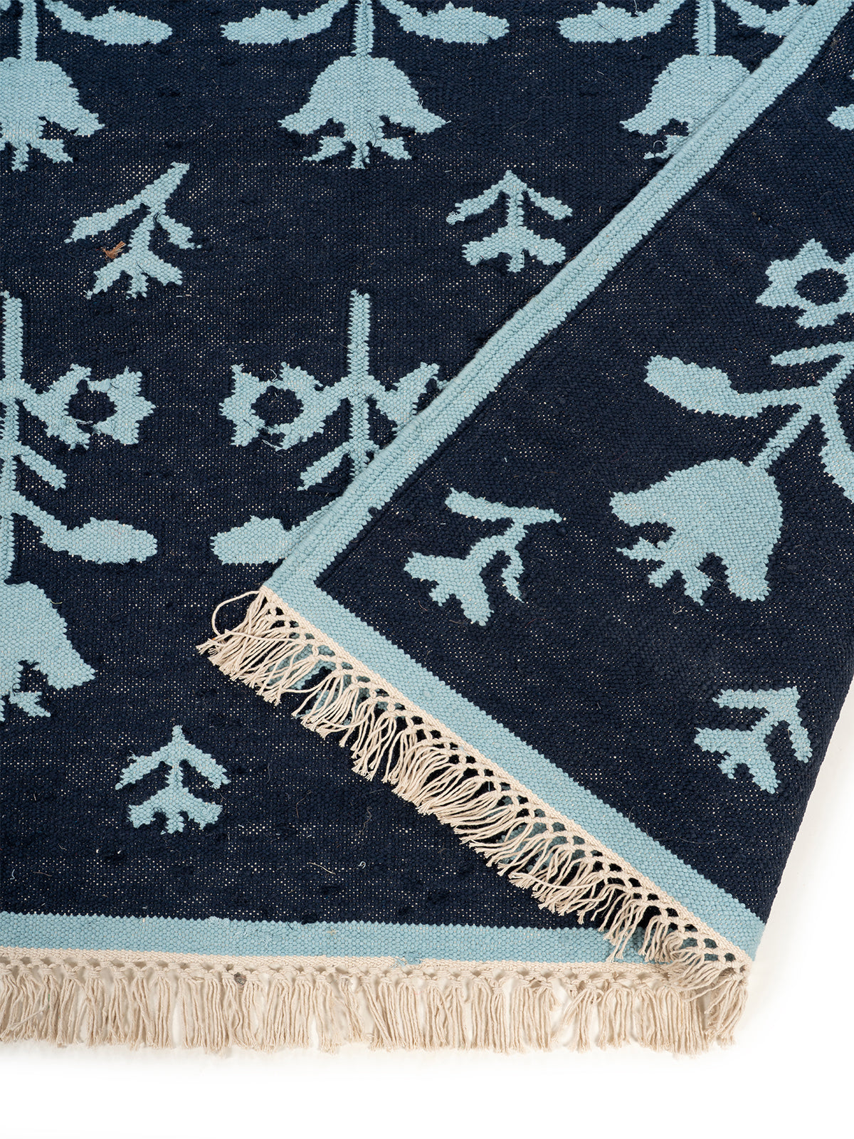 Midnight Tulip Flatweave Rug detail of the floral motif in wool cut pile