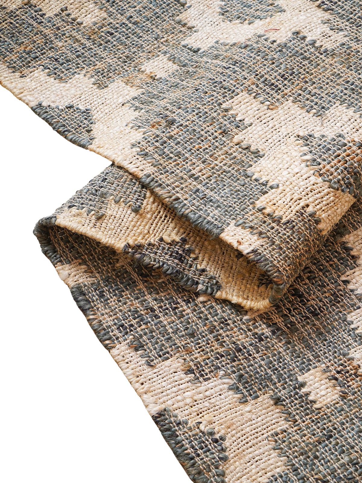 Monochrome Kilim Jute Rug jute rug styled in a living room interior