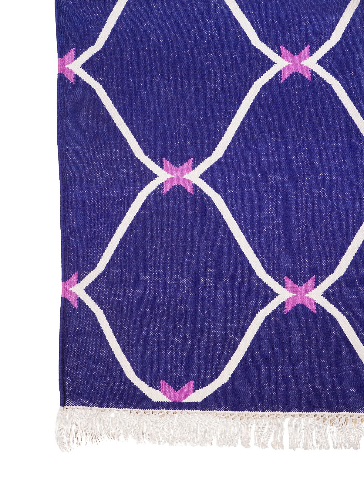 Moonlit Ogee Rug wool rug styled in a living room interior