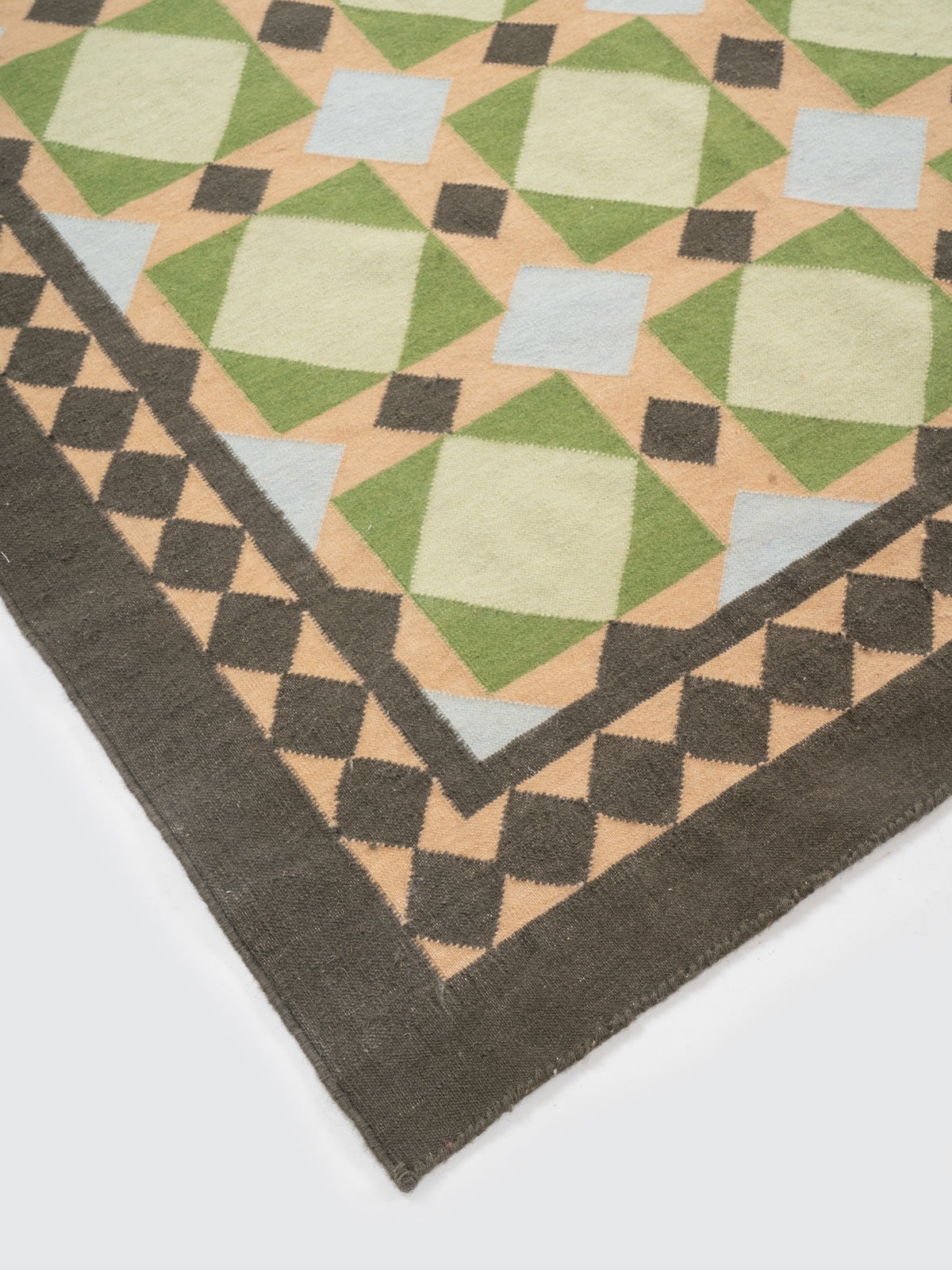 Mosaic Meadow Wool Rug-Sage close-up showing the wool weave and geometric motif