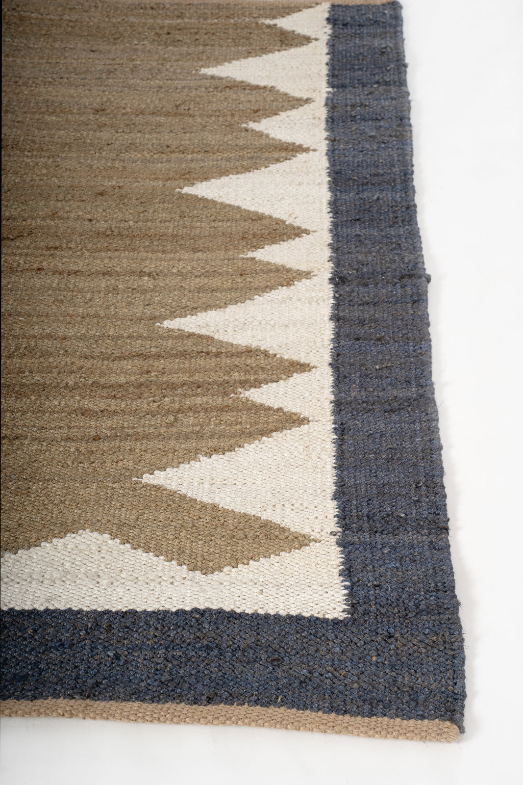 Mountain Ridge Jute Rug jute rug styled in a living room interior
