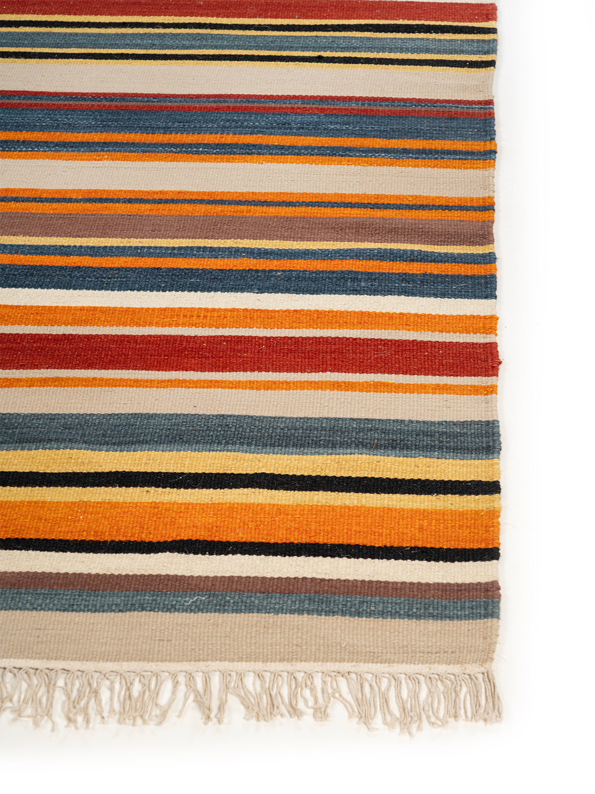 Multi-Stripe Wool Flatweave Rug wool rug styled in a living room interior