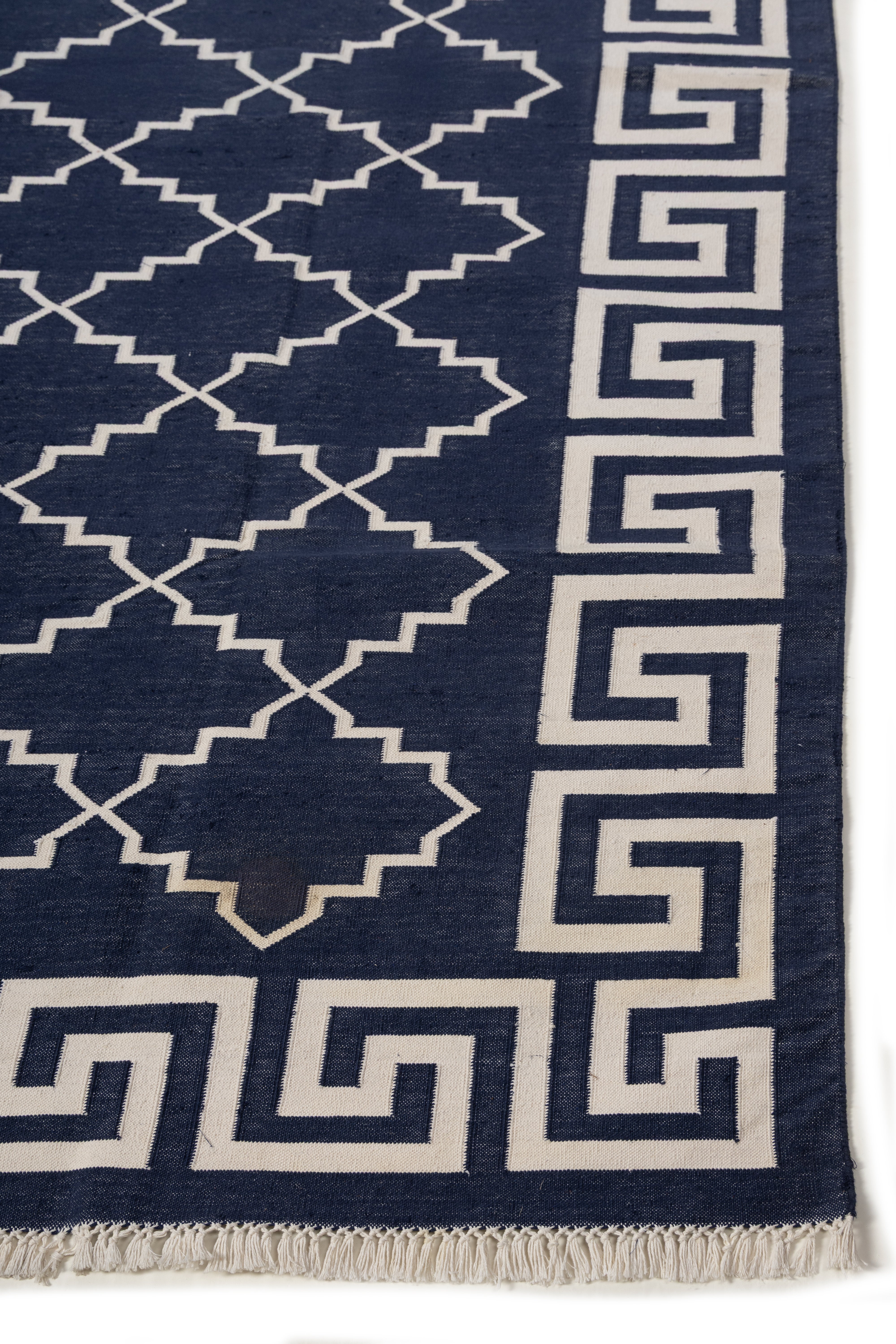 Nautical Jali Flatweave rug-Navy cotton rug styled in a living room interior