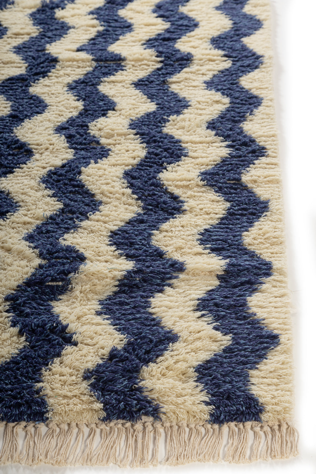 Ocean Drift Wool Rug wool rug styled in a living room interior