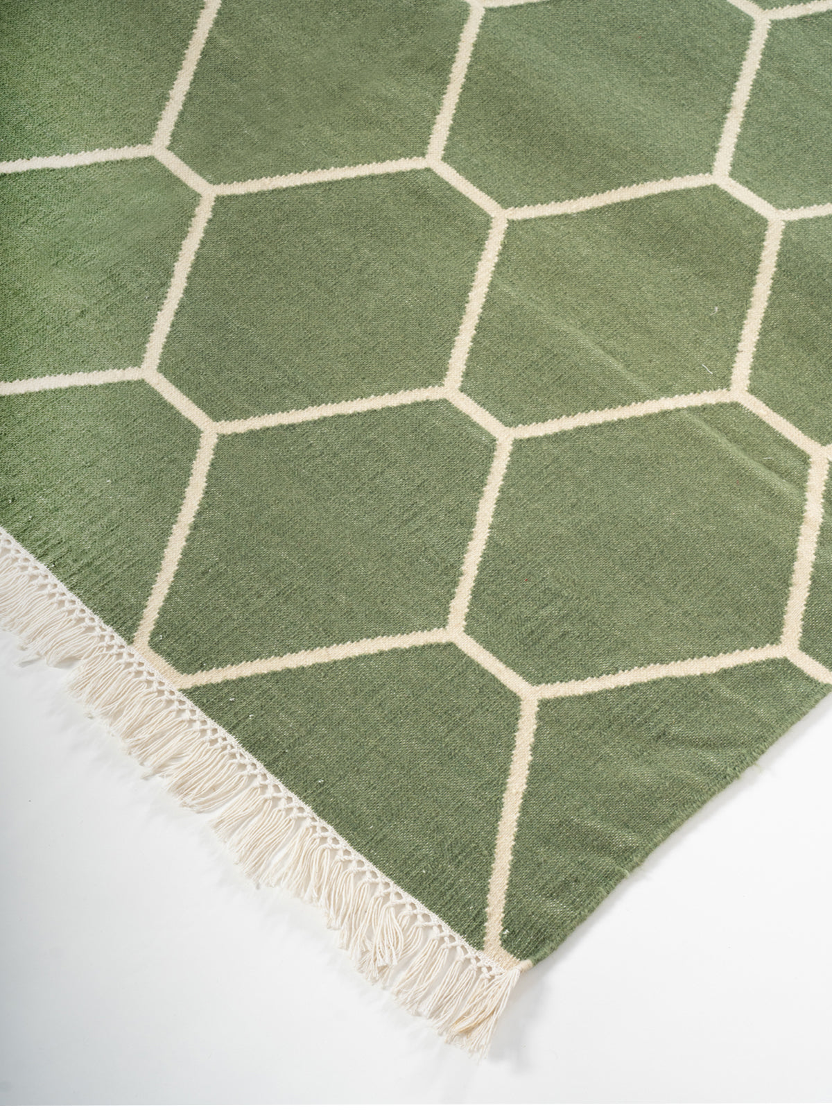 Olive Vine Dhurrie rug close-up showing the cotton pile and floral motif