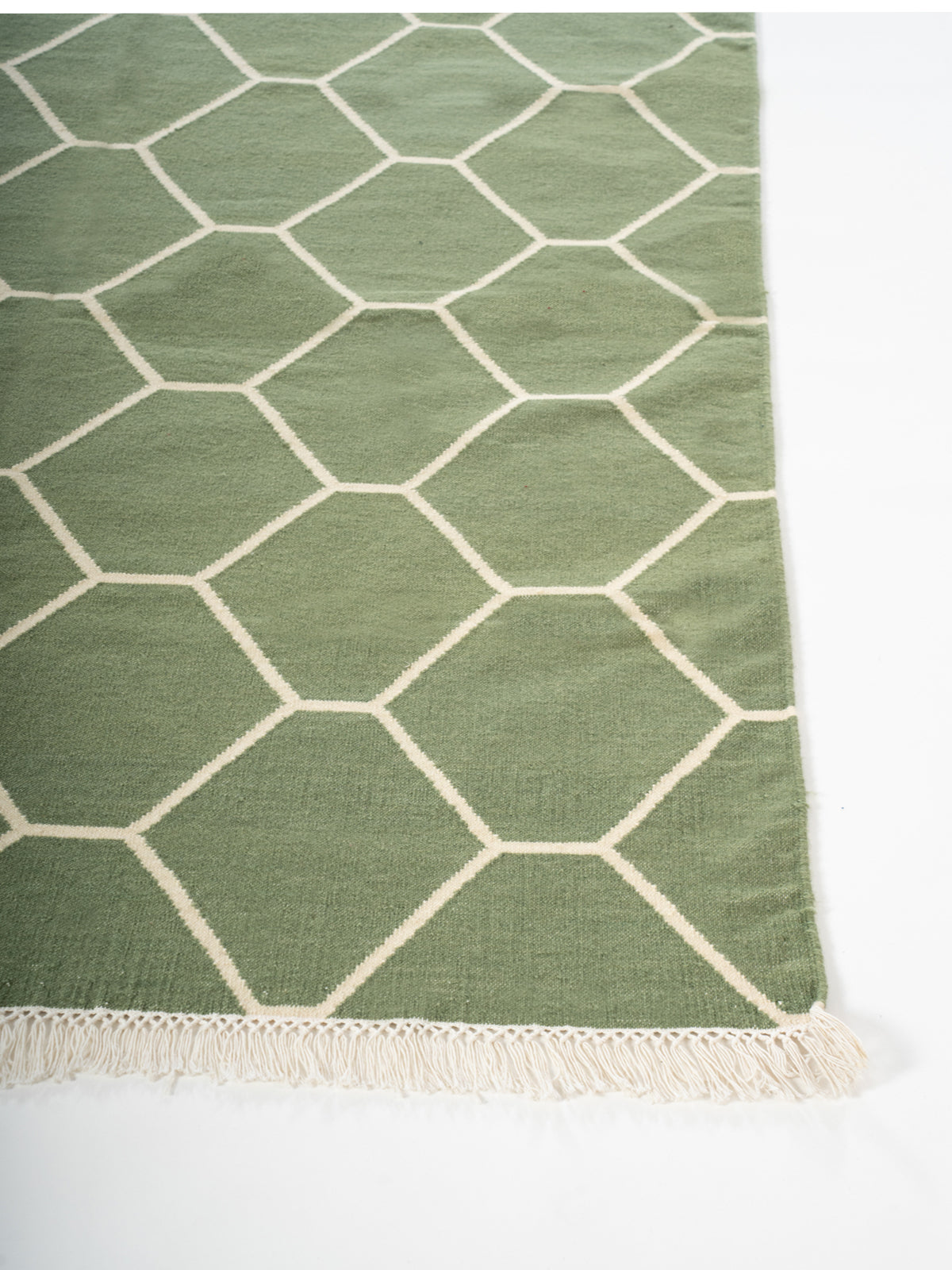 Olive Vine Dhurrie rug cotton rug styled in a living room interior