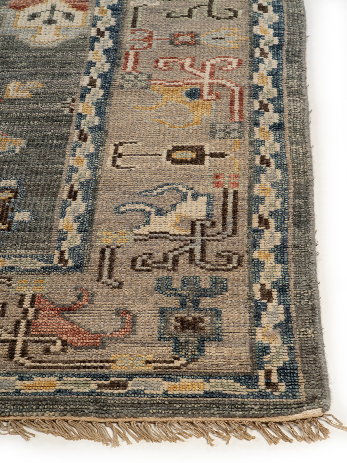 Orion Medallion Wool Rug handspun wool rug styled in a living room interior
