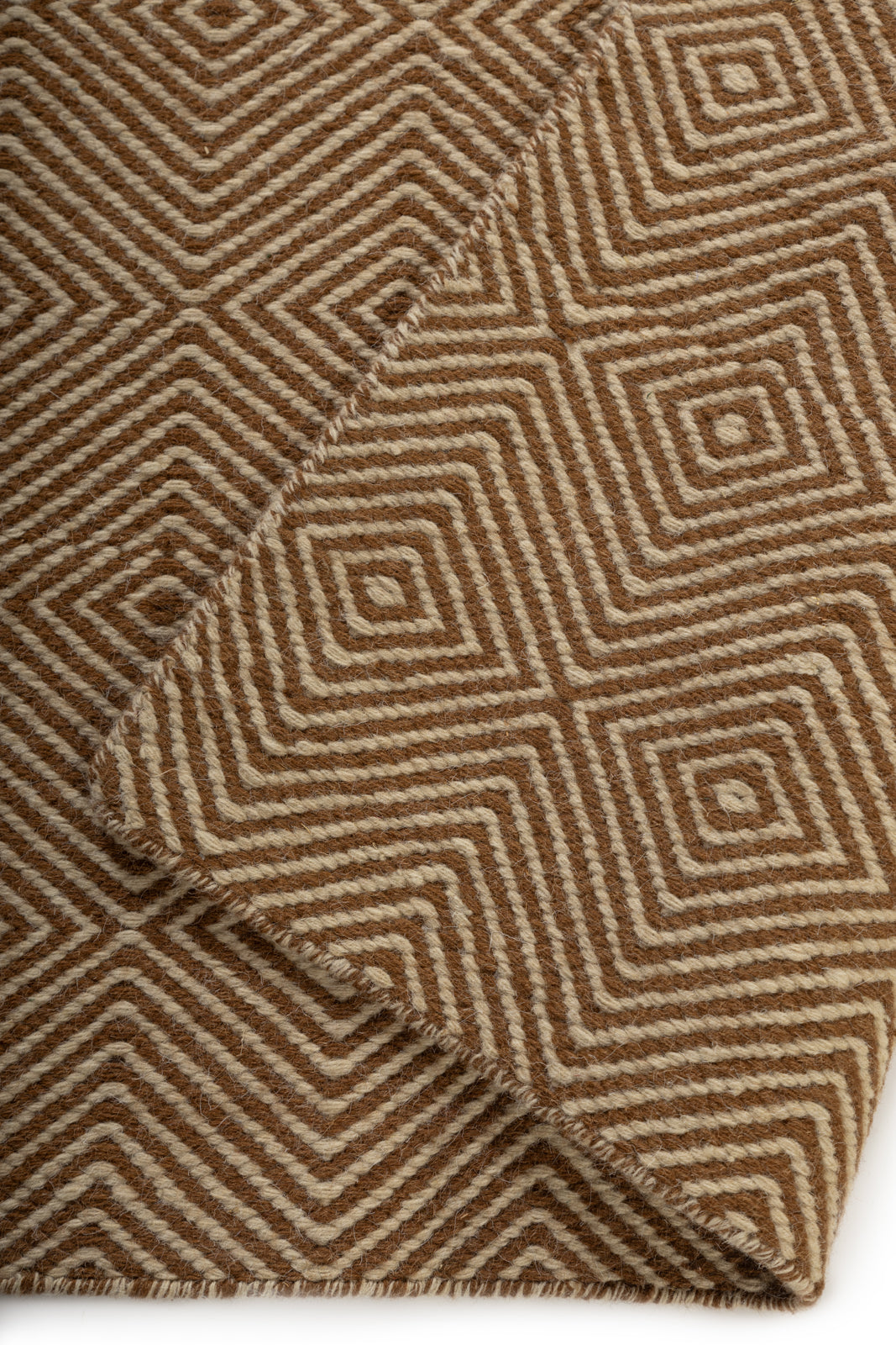 Parallel Peaks Wool Rug detail of the striped wool surface and edge finishing