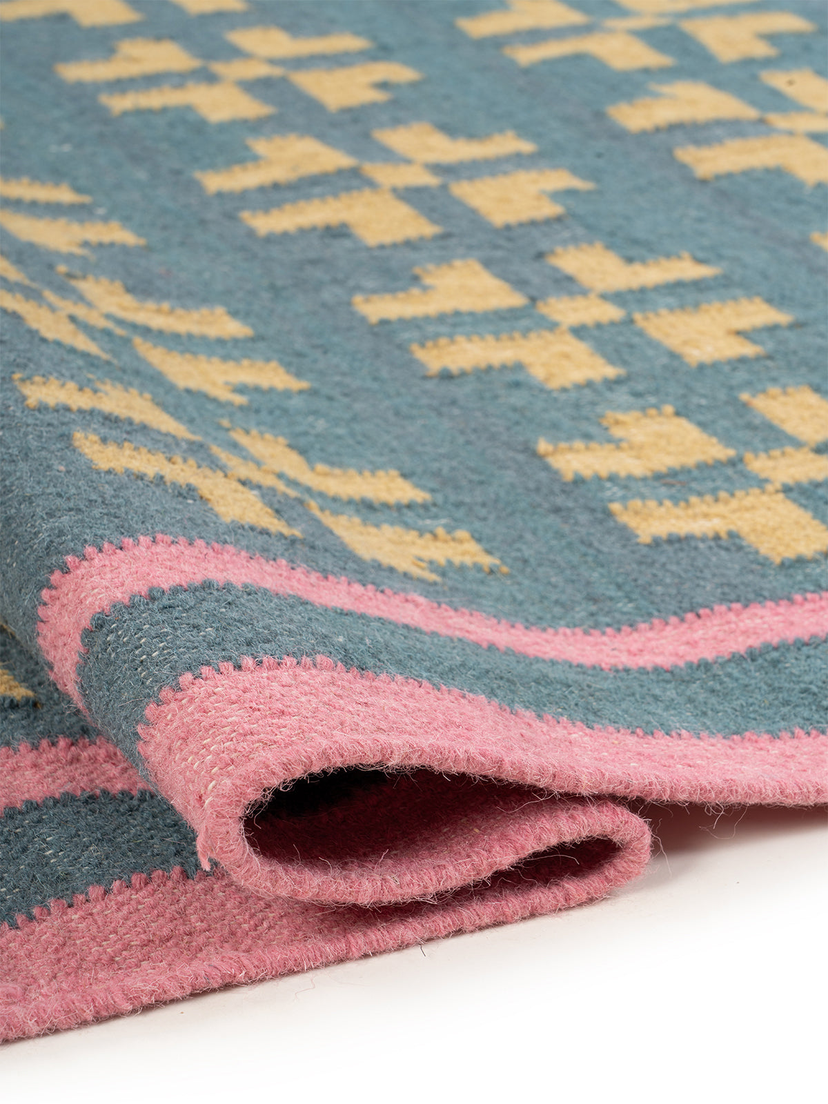 Pastel Cross Motif Flatweave Rug - texture detail showing wool surface