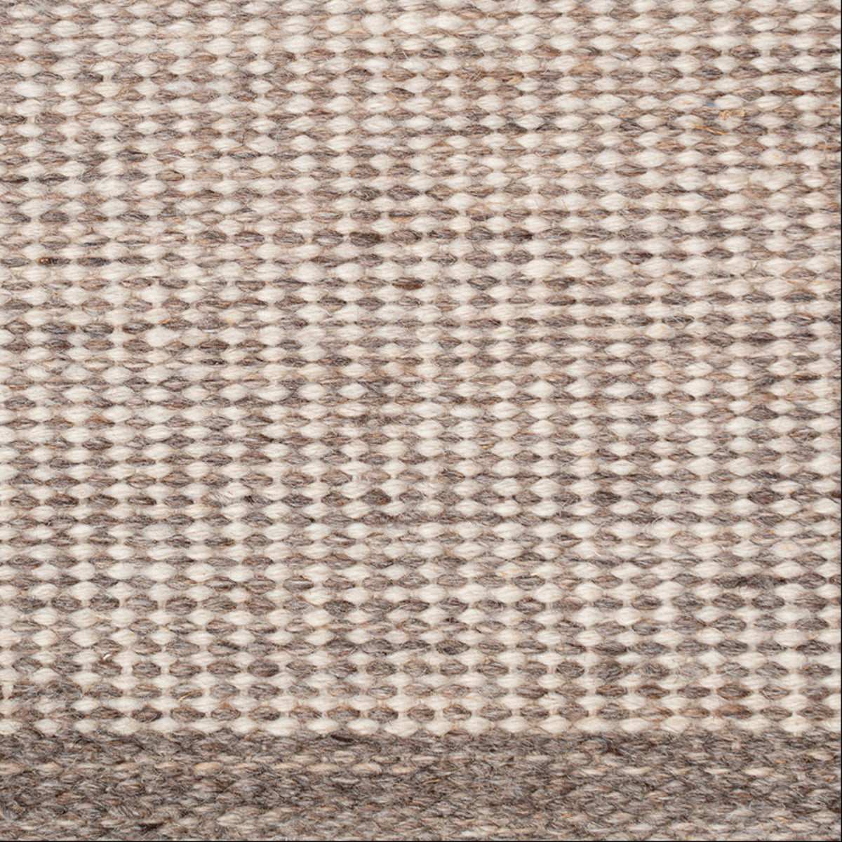 Pathra : Fossil grain close-up showing the afghan wool weave and geometric motif