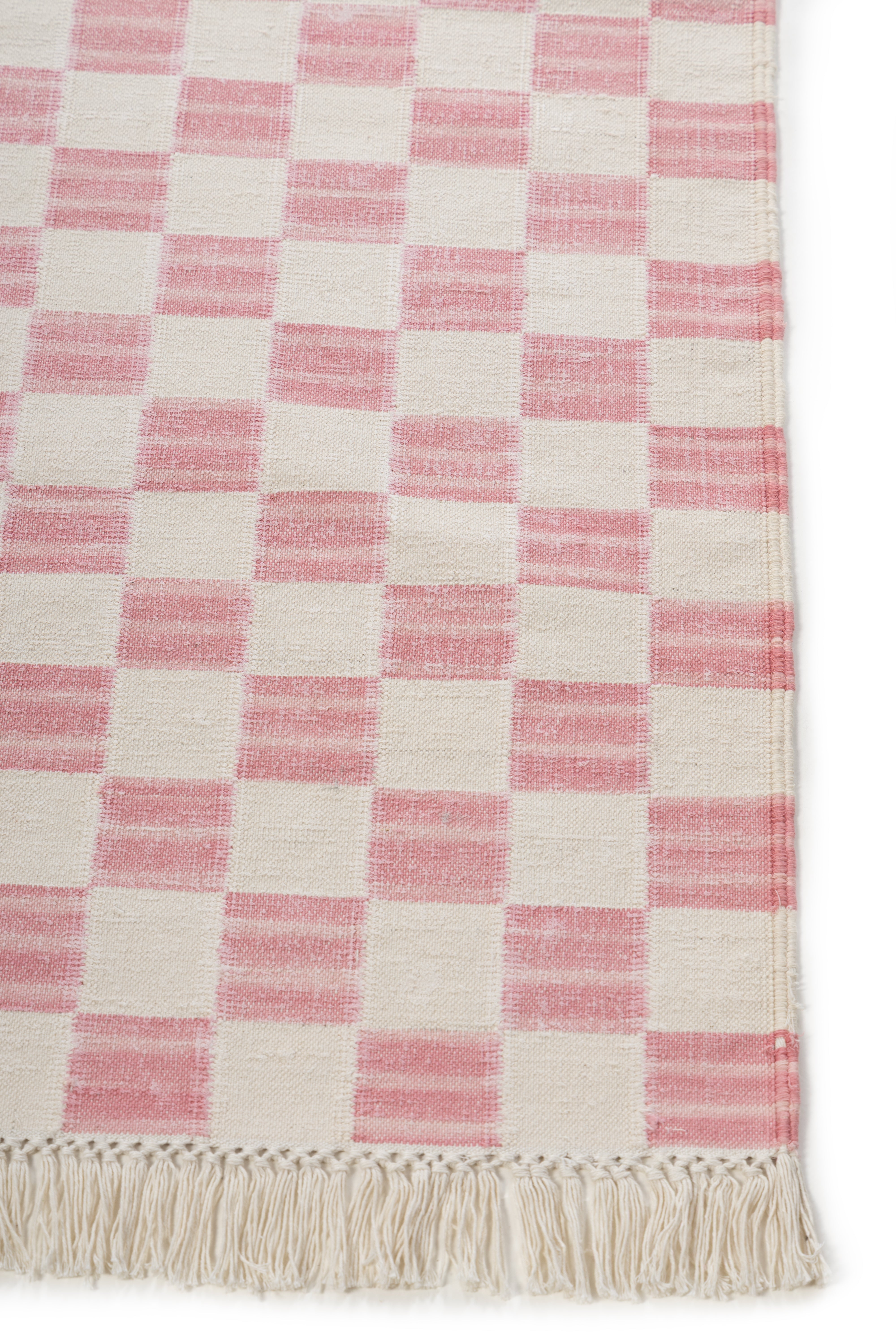 Rosewood Checkered Rug cotton rug styled in a living room interior