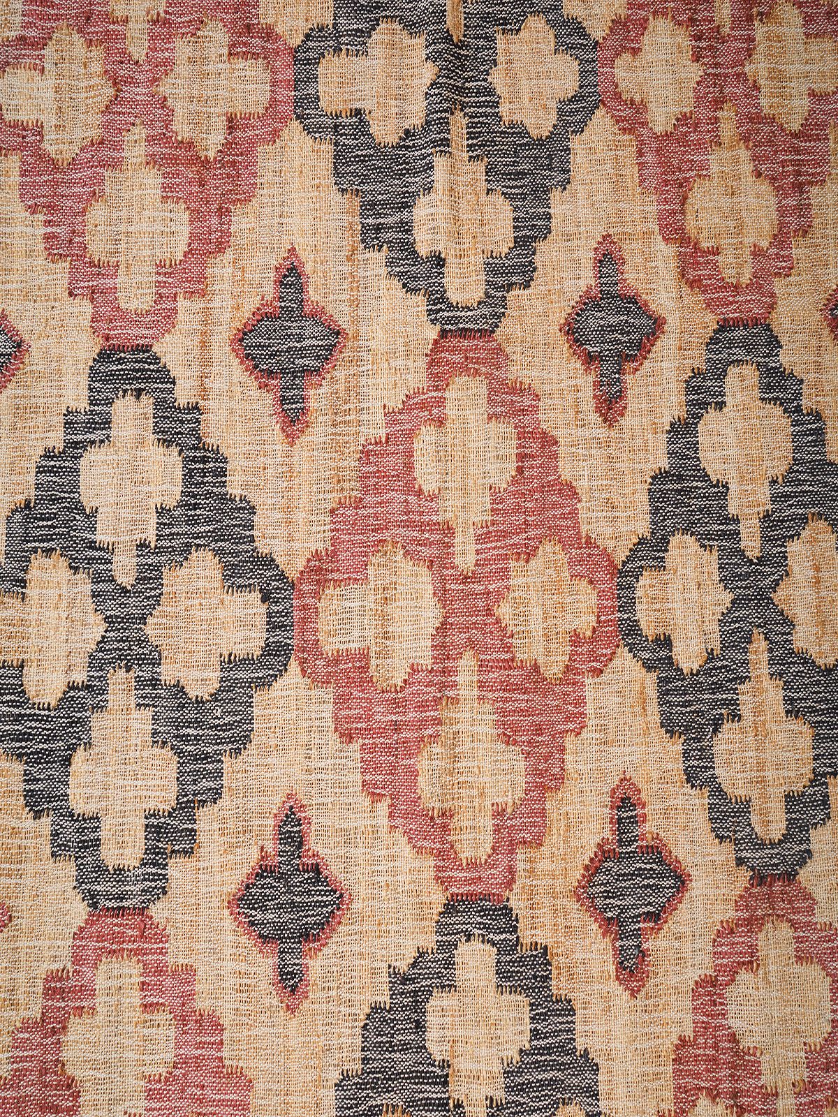 Rouge Reflection Jute Rug jute rug styled in a living room interior