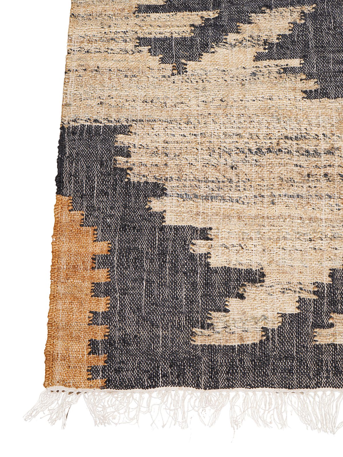 Rustic Echoes Kilim Weave Rug jute rug styled in a living room interior