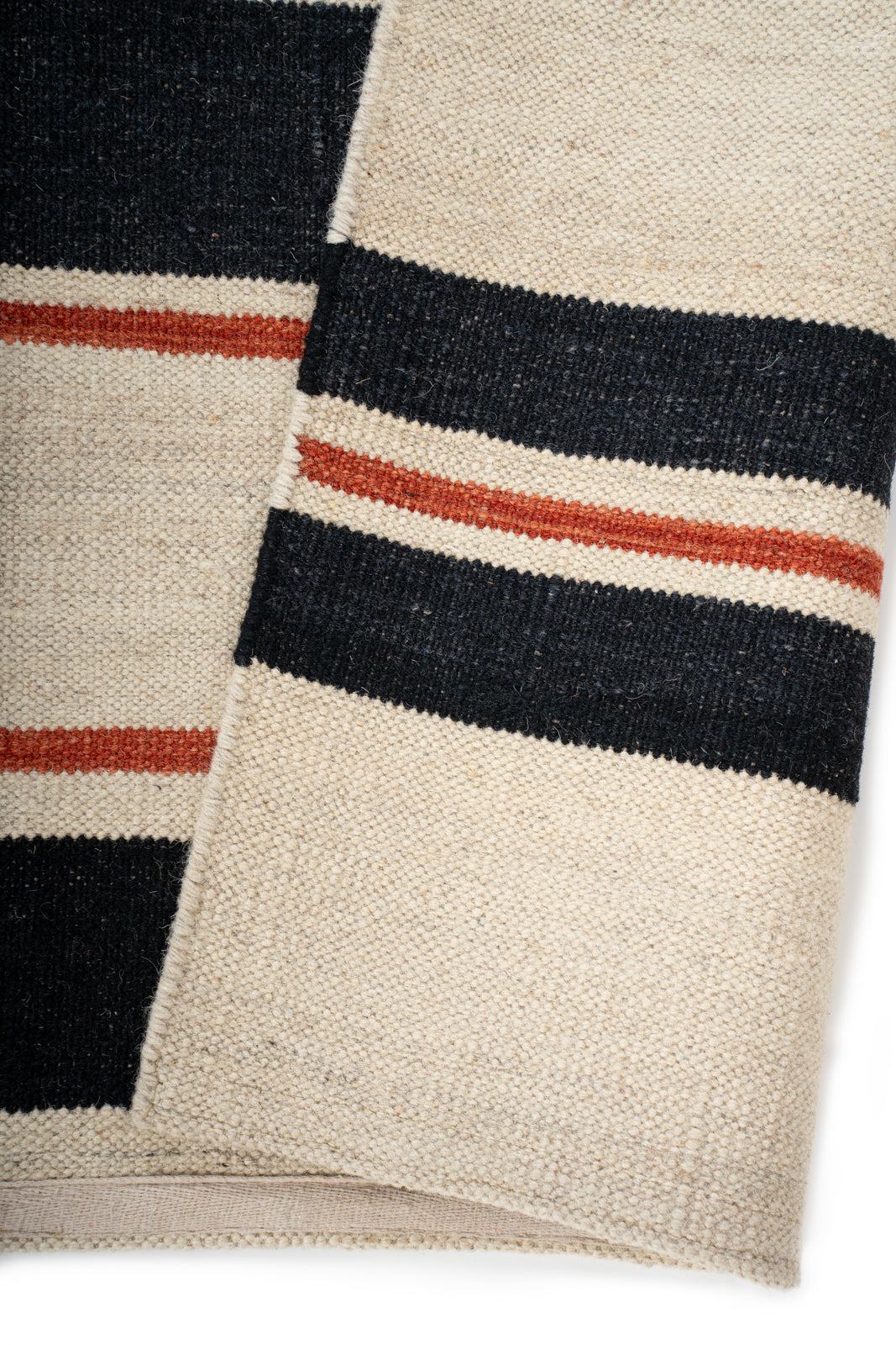 Rustic Ember Weave Rug detail showing the textured wool surface and finishing