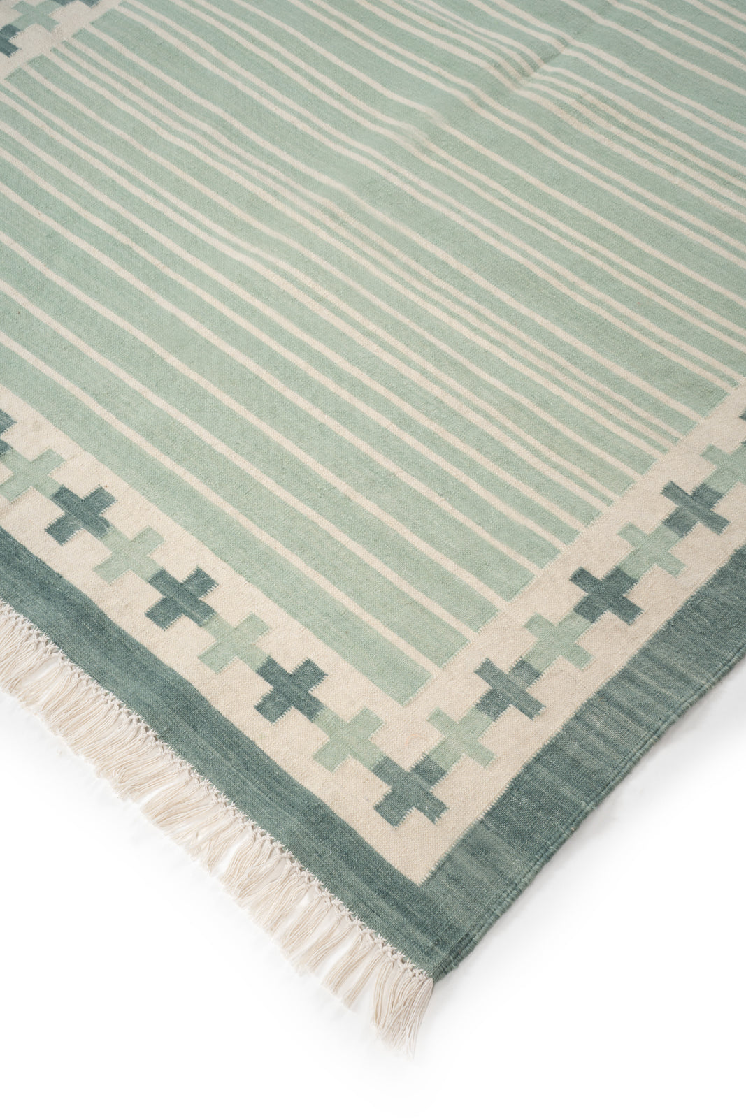 Sage Comfort Flatweave Rug close-up showing the cotton weave and surface texture