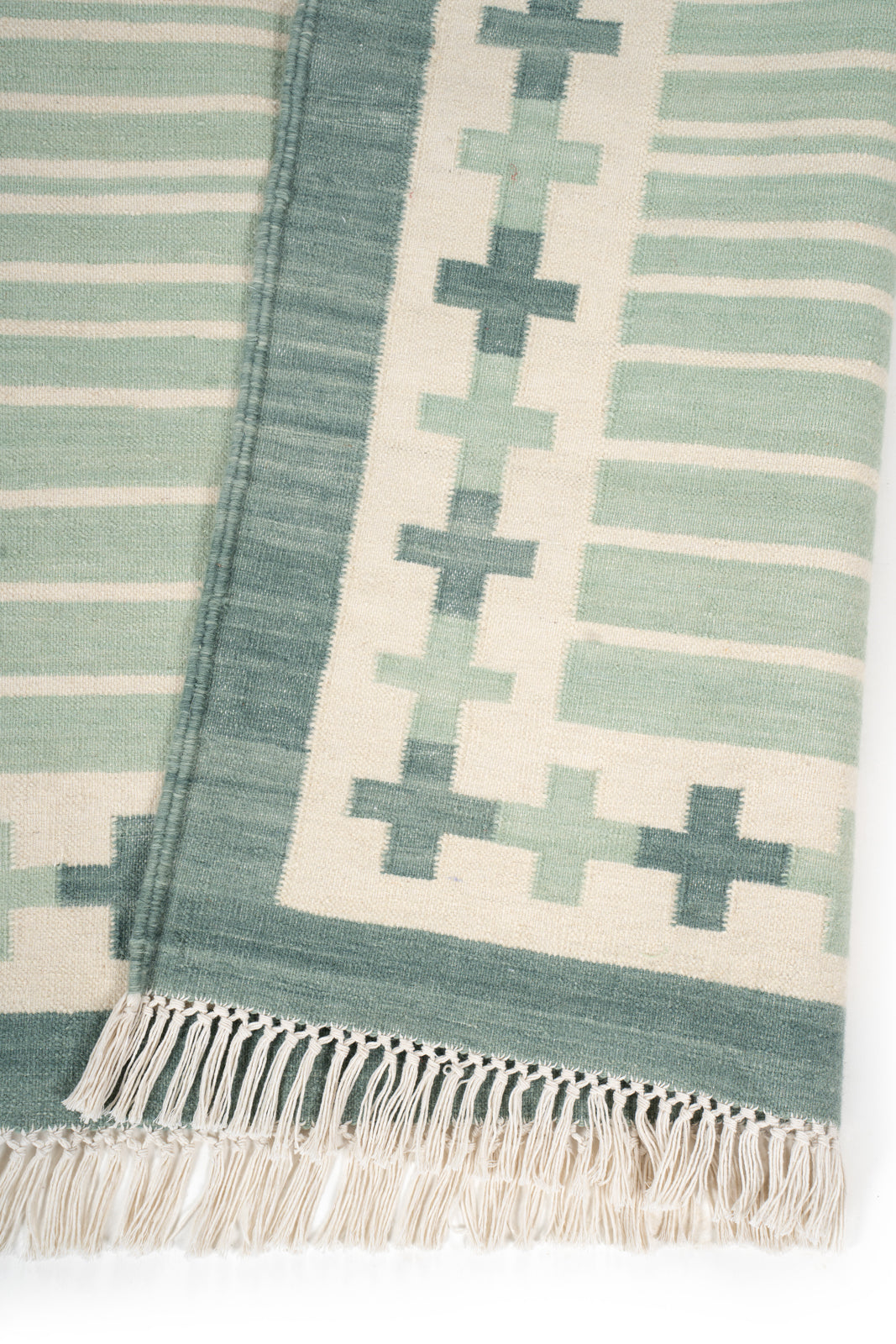 Sage Comfort Flatweave Rug detail showing the textured cotton surface and finishing