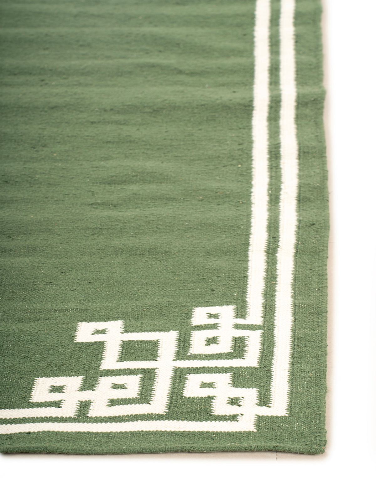 Sage Cornerstone Rug wool rug styled in a living room interior