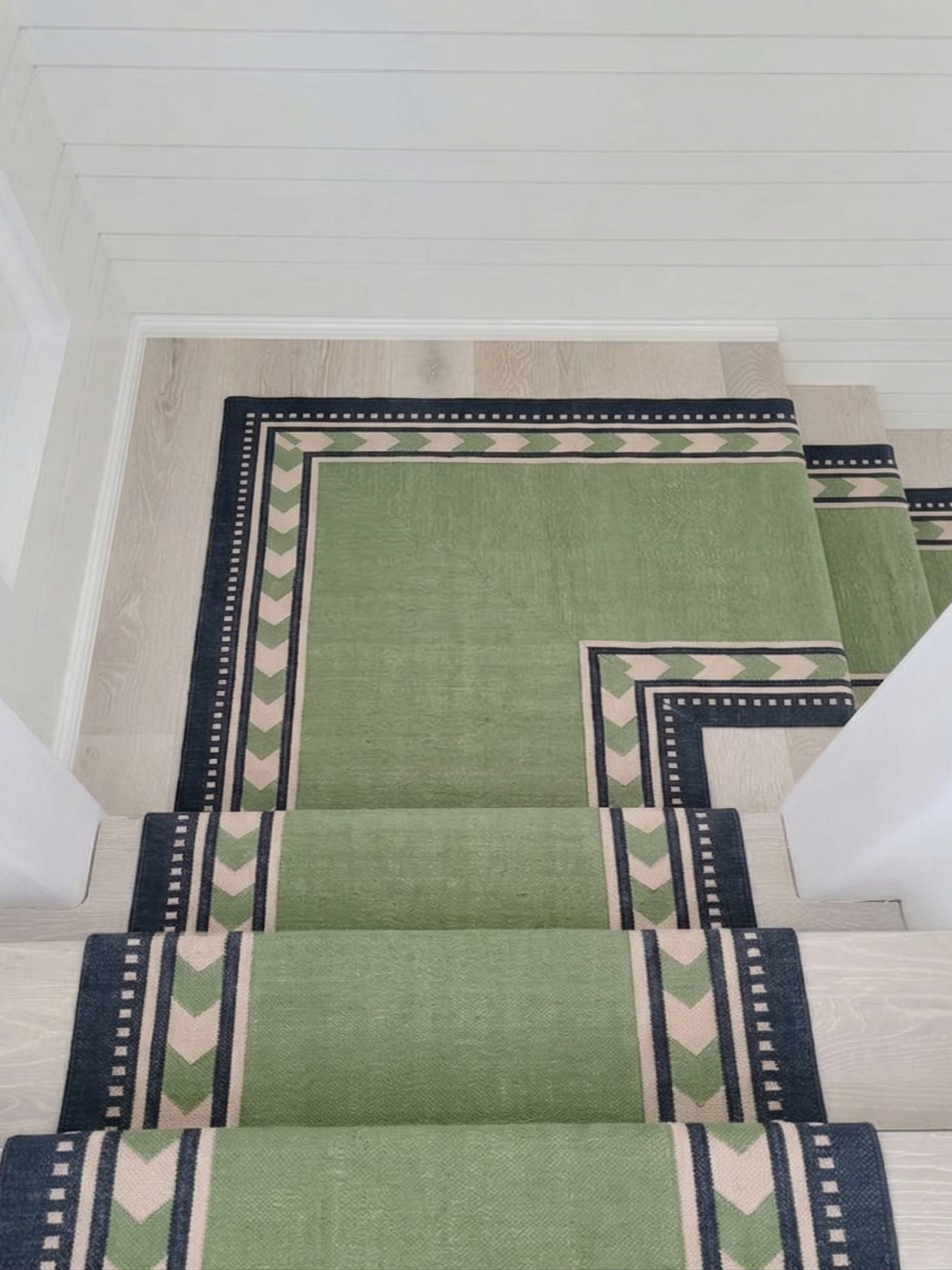 Sage Moor Runner cotton stair runner styled on a staircase in a designed interior