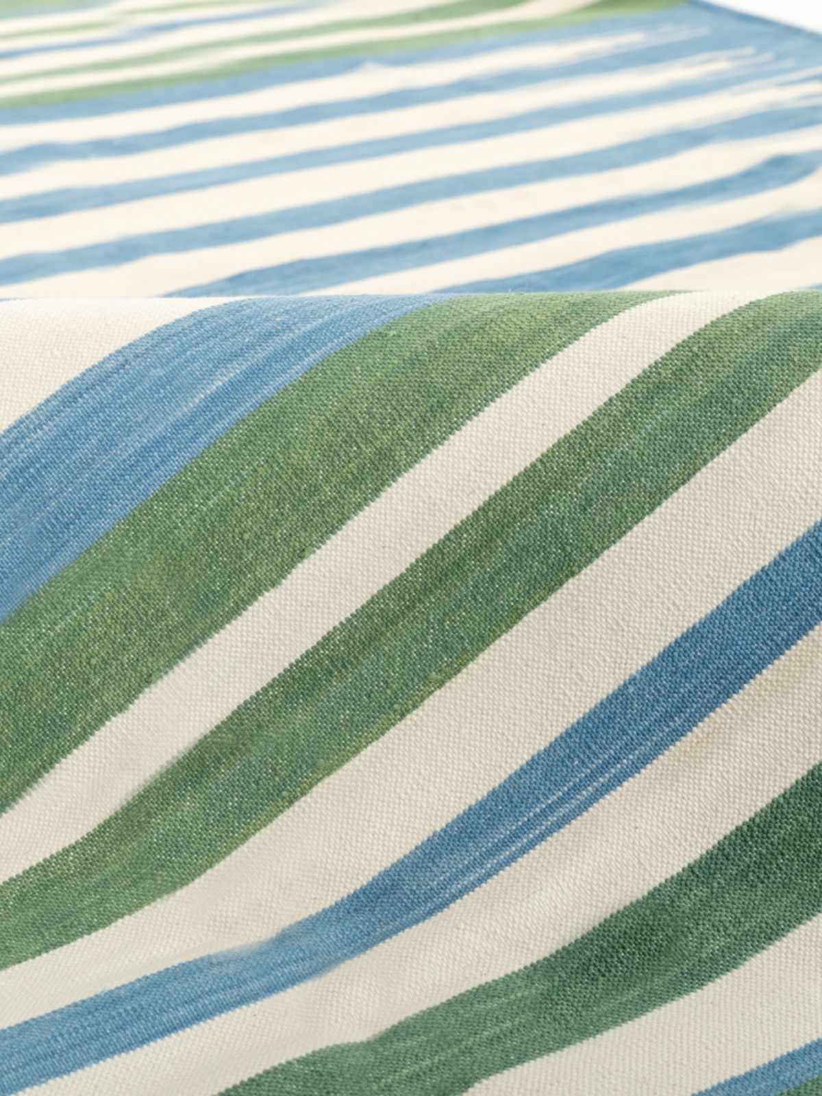 Sage Skyline Striped Rug detail of the striped cotton surface and edge finishing