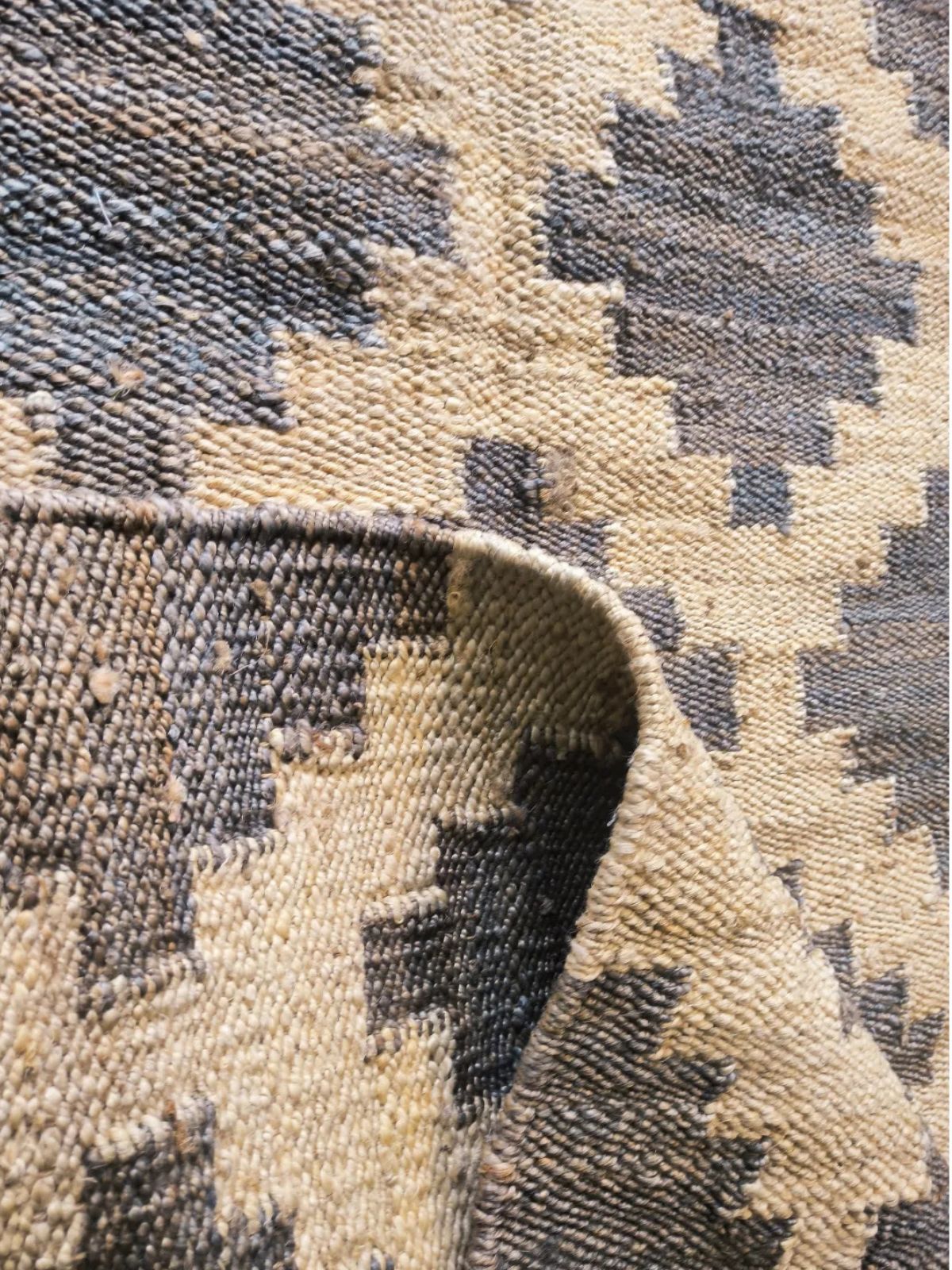 Sand and Shadows Bengal Jute Rug detail showing the textured jute surface and finishing