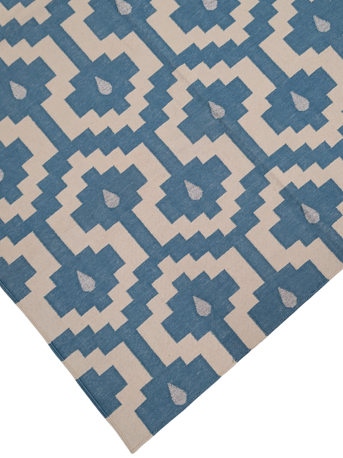 Santorini Steps Flatweave Rug close-up showing the cotton weave and geometric motif