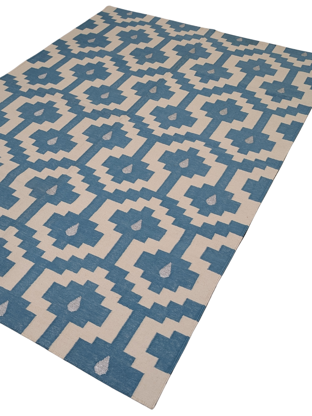 Santorini Steps Flatweave Rug cotton rug styled in a living room interior