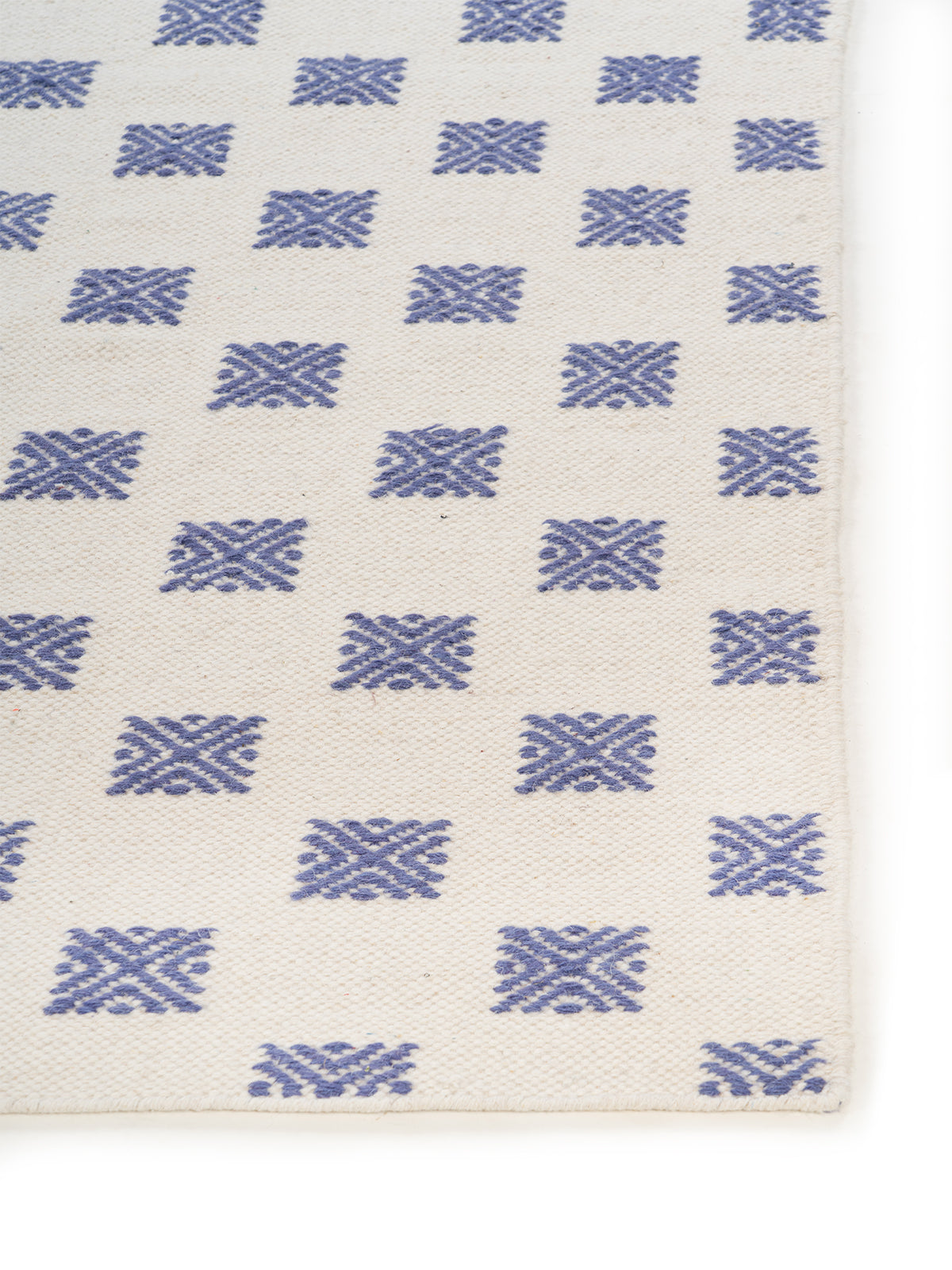 Scandi Lattice Wool Rug wool rug styled in a living room interior
