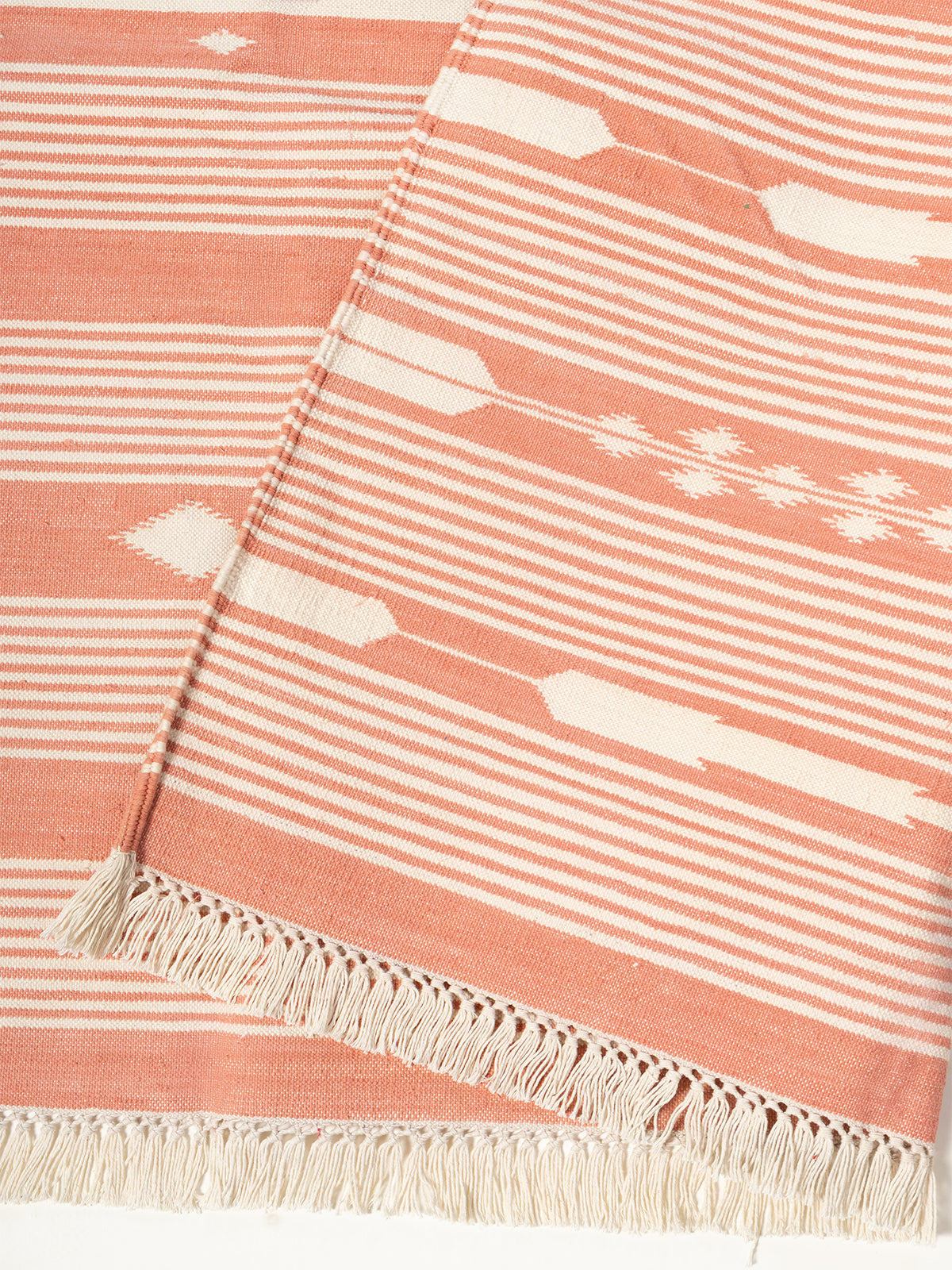 Serenity Stripes Flatweave Rug-Peach detail of the striped cotton surface and edge finishing