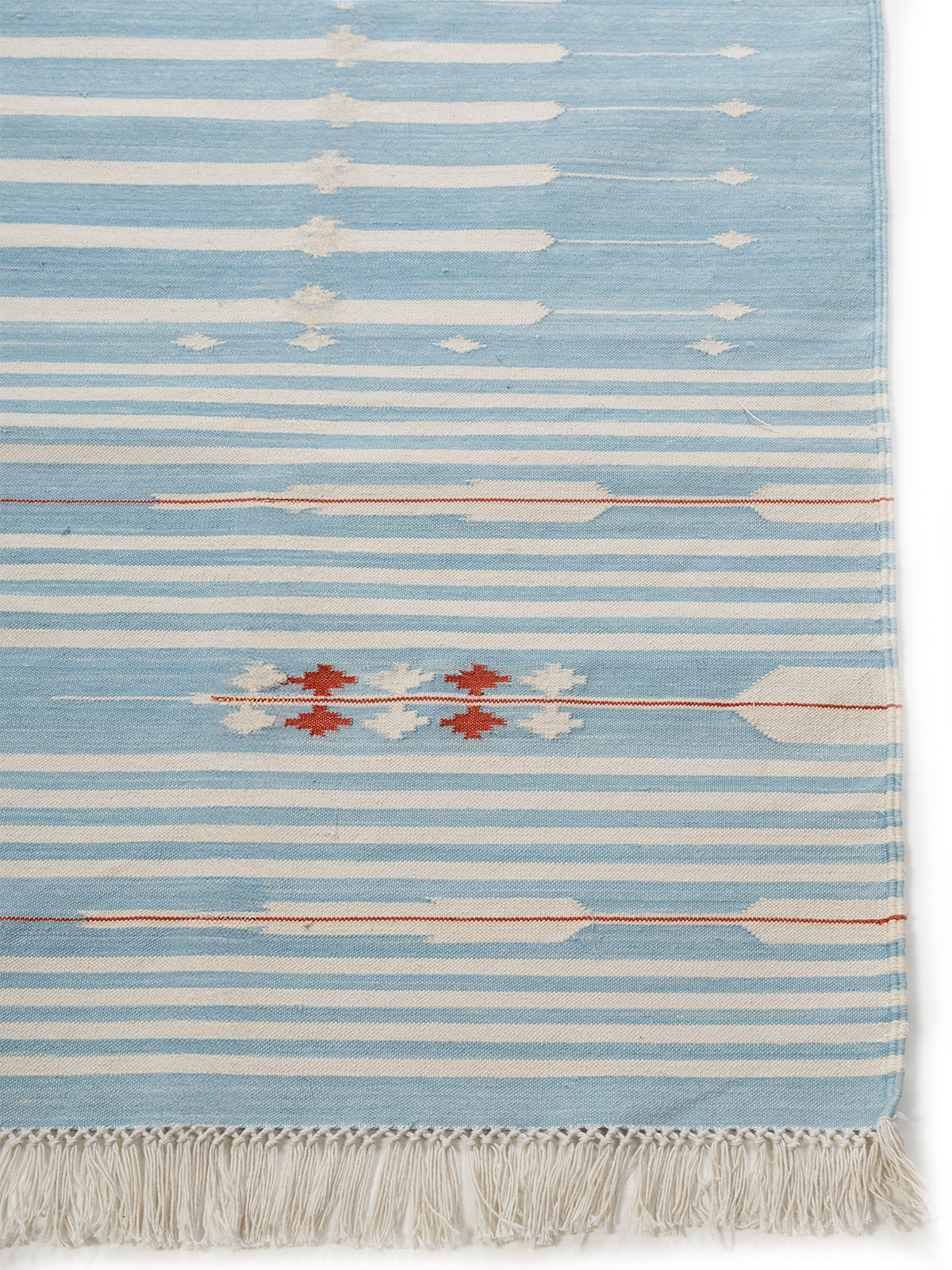 Sky Drift Rug cotton rug styled in a living room interior