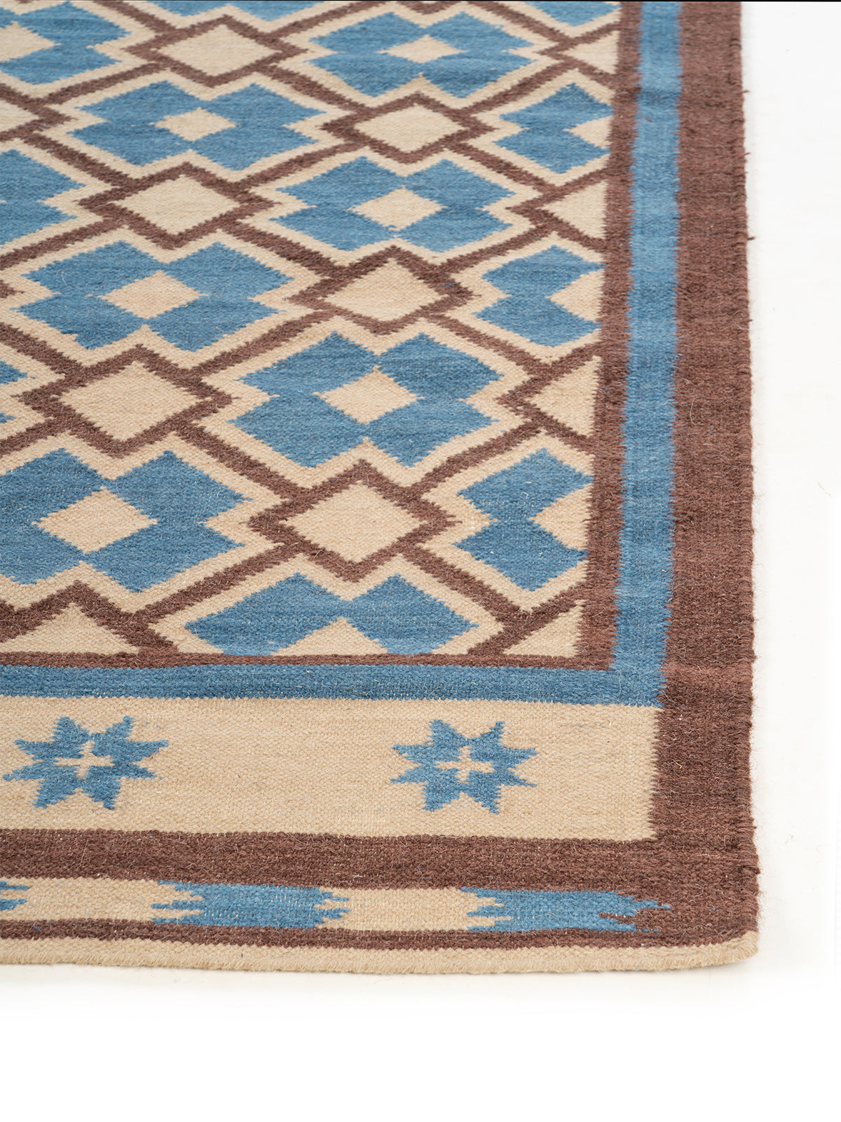 Southwest Diamond Wool Rug wool rug styled in a living room interior