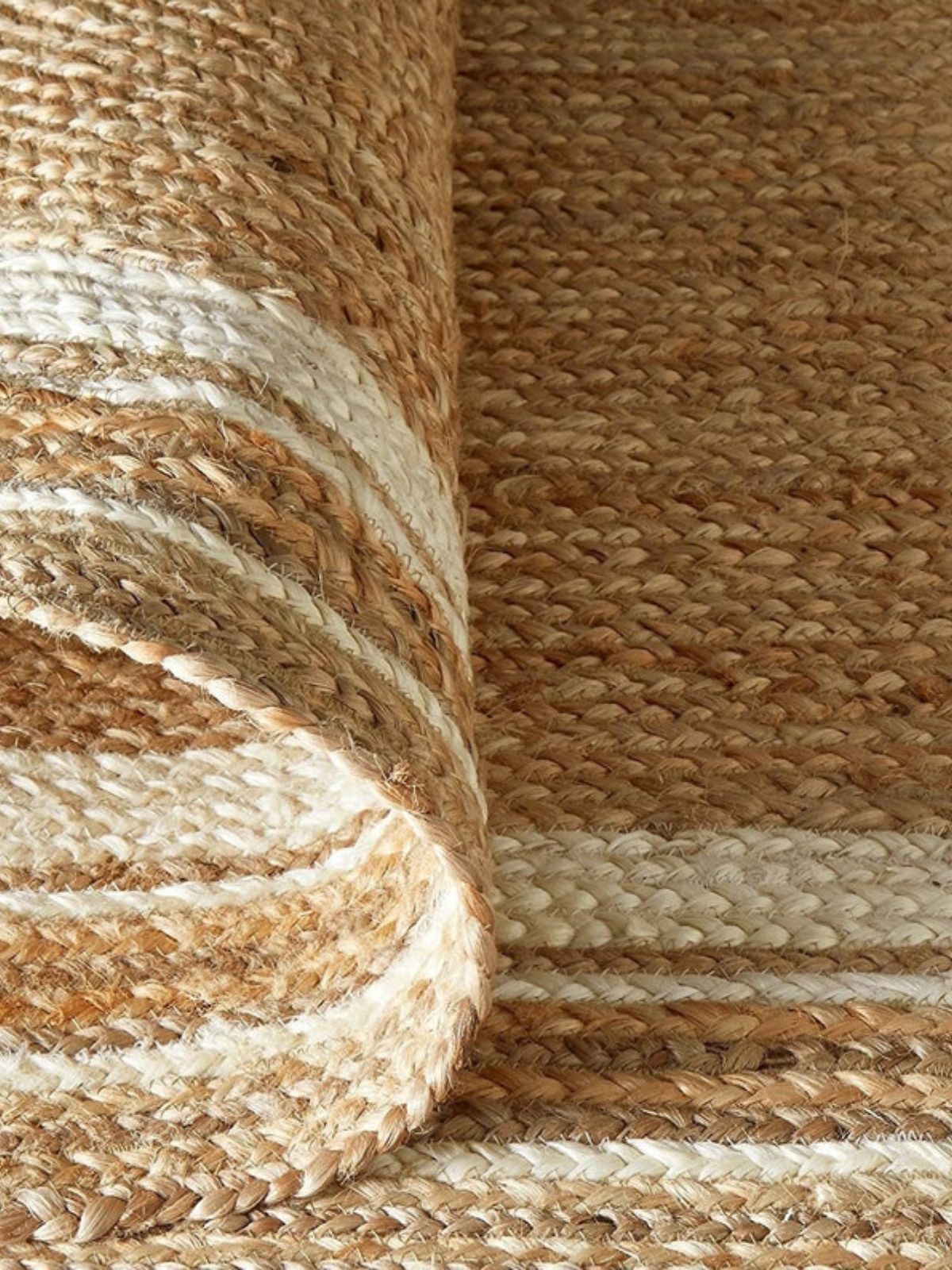 Suez Bordered Jute Braided Runner - jute runner laid in a hallway view