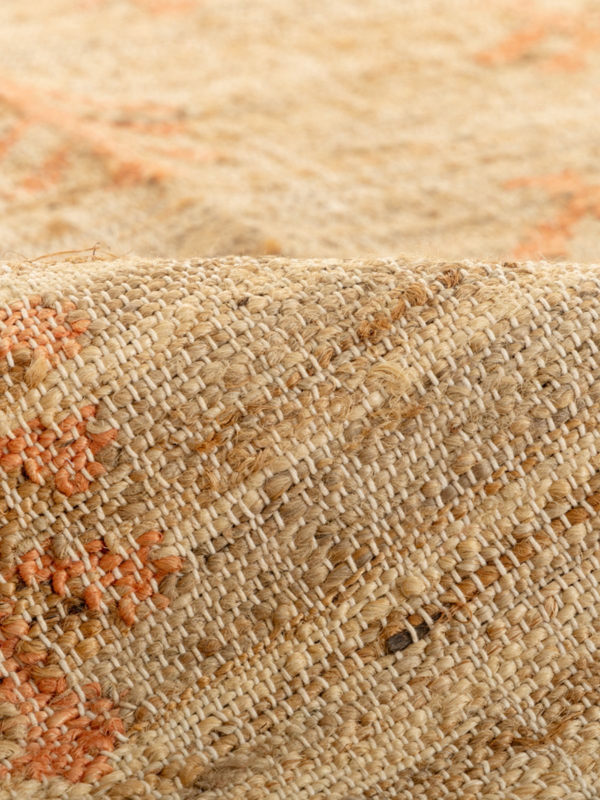 Sunset Foliage Jute Rug detail of the floral motif in jute cut pile