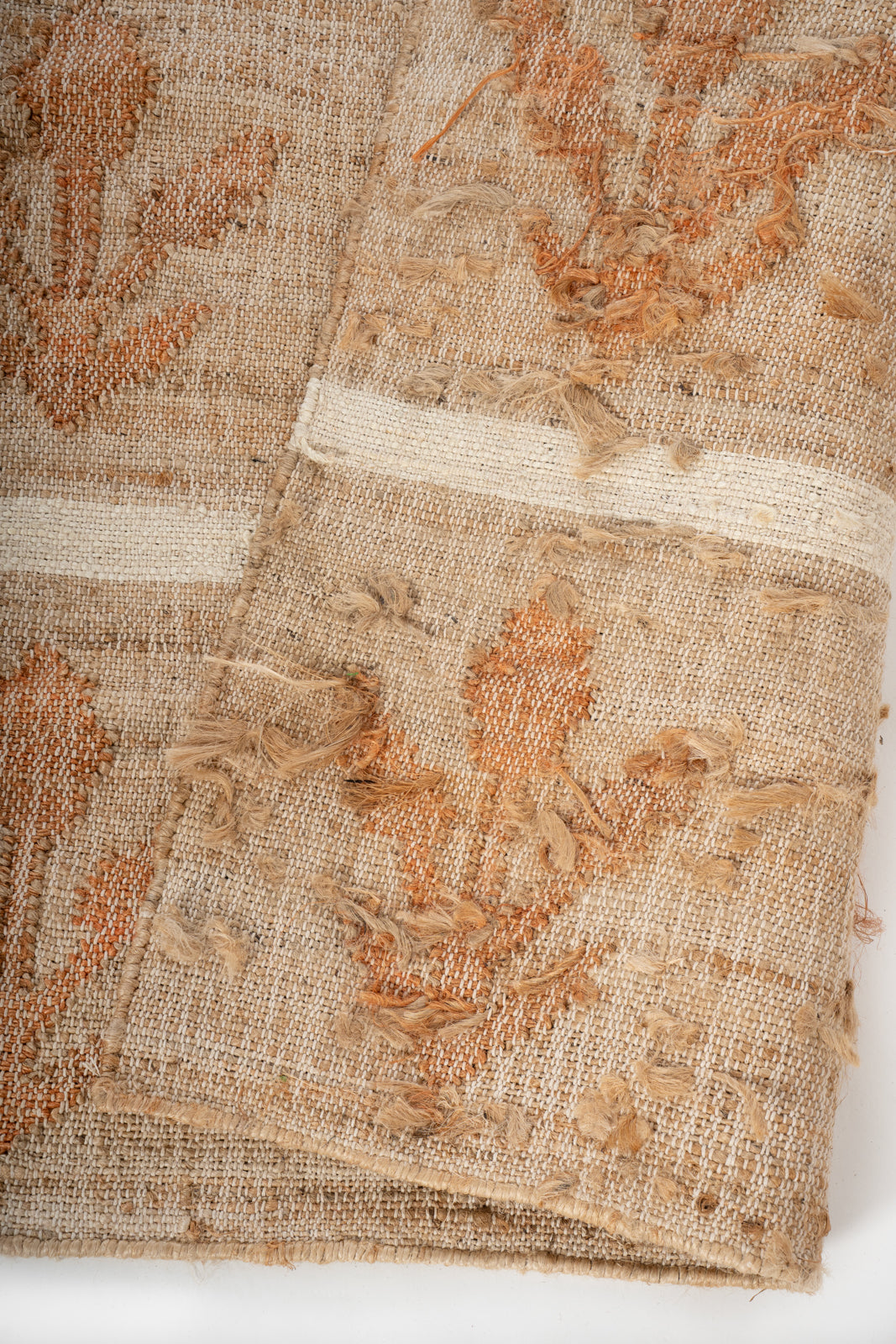 Sunset Grove Handwoven Jute Rug detail of the striped jute surface and edge finishing