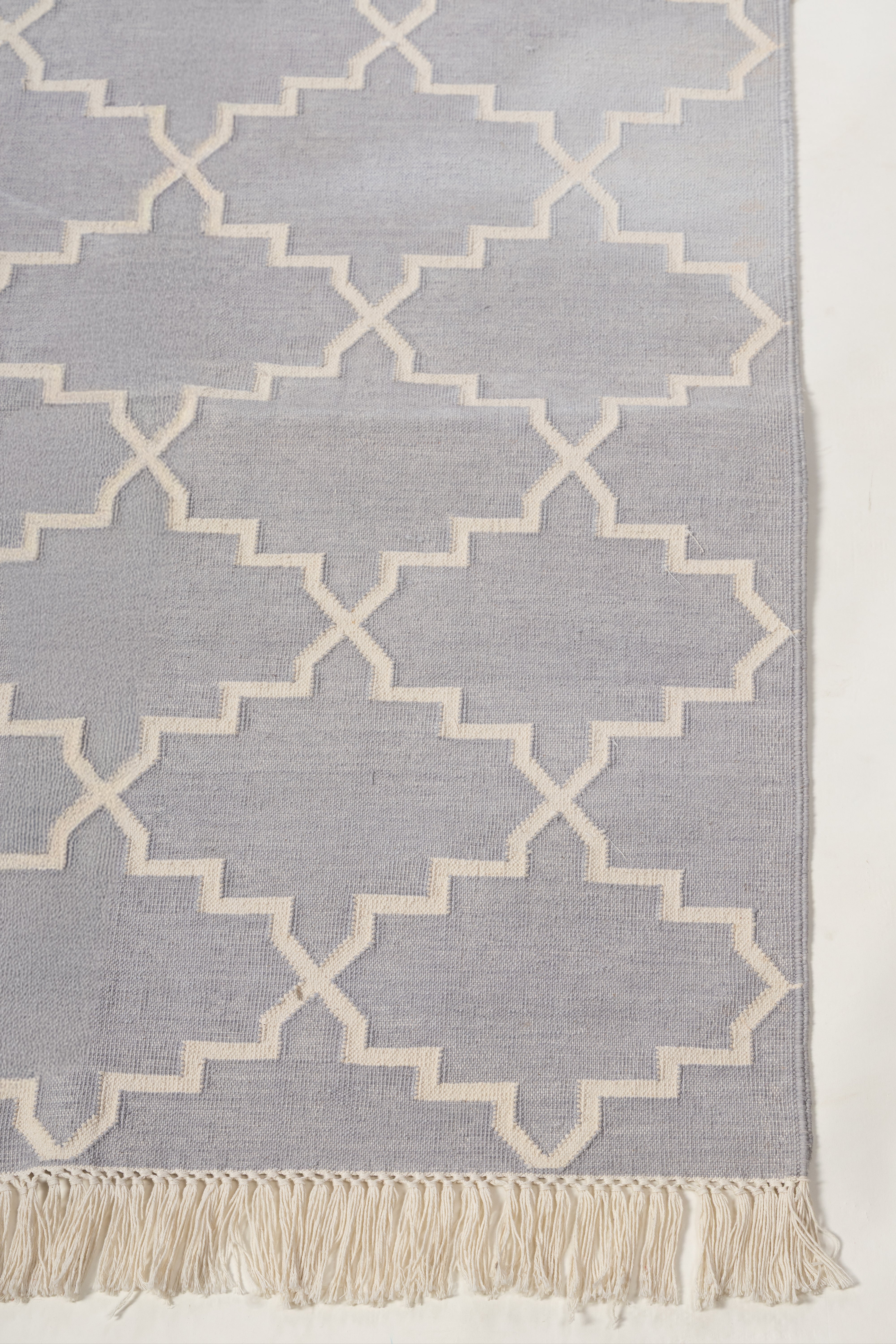 Symmetry Flatweave Rug-Grey cotton rug styled in a living room interior