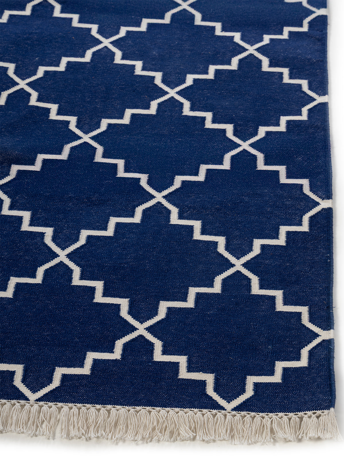 Symmetry Flatweave Rug-Navy cotton rug styled in a living room interior
