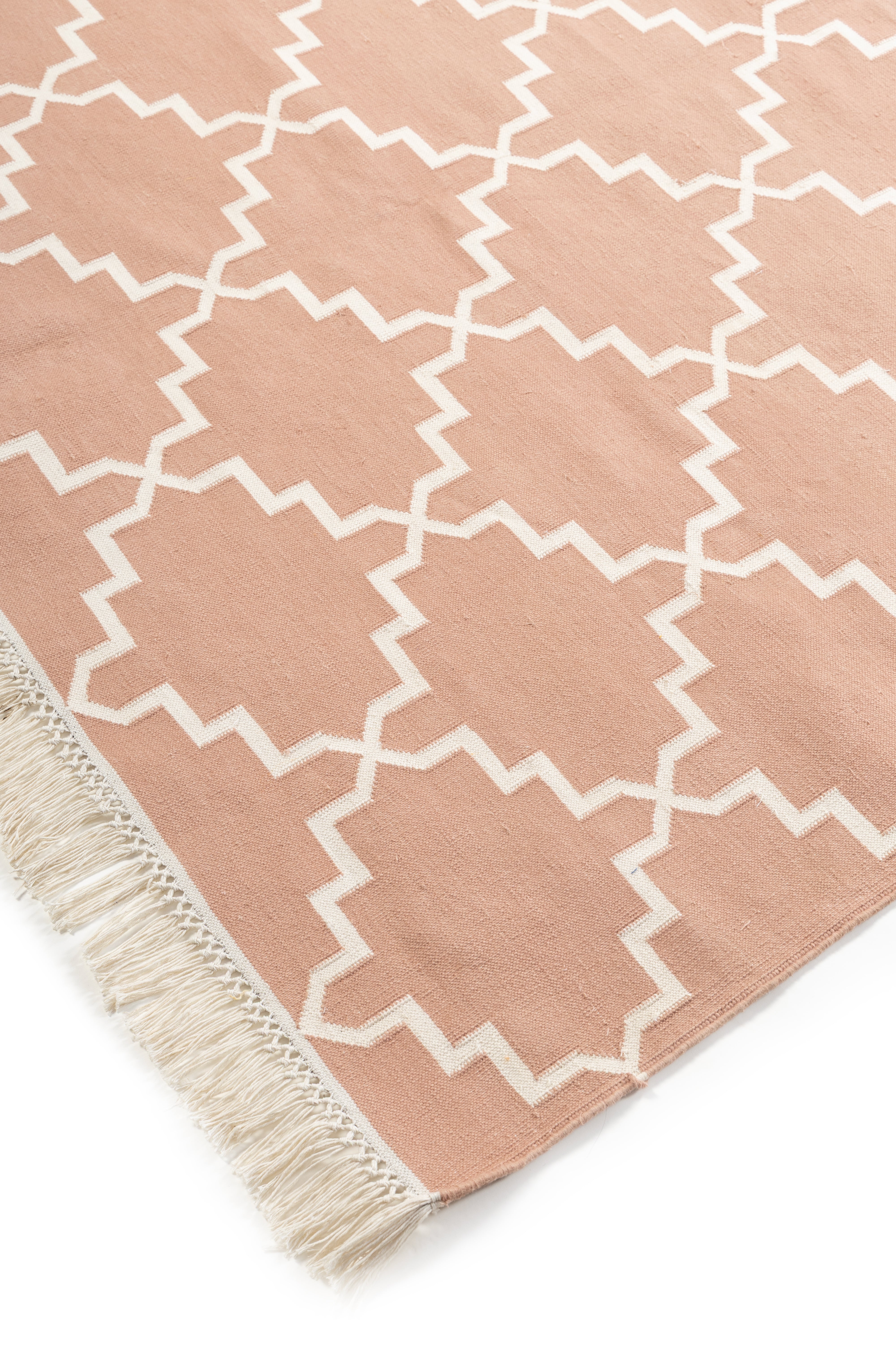 Symmetry Flatweave Rug-Peach close-up showing the cotton weave and geometric motif