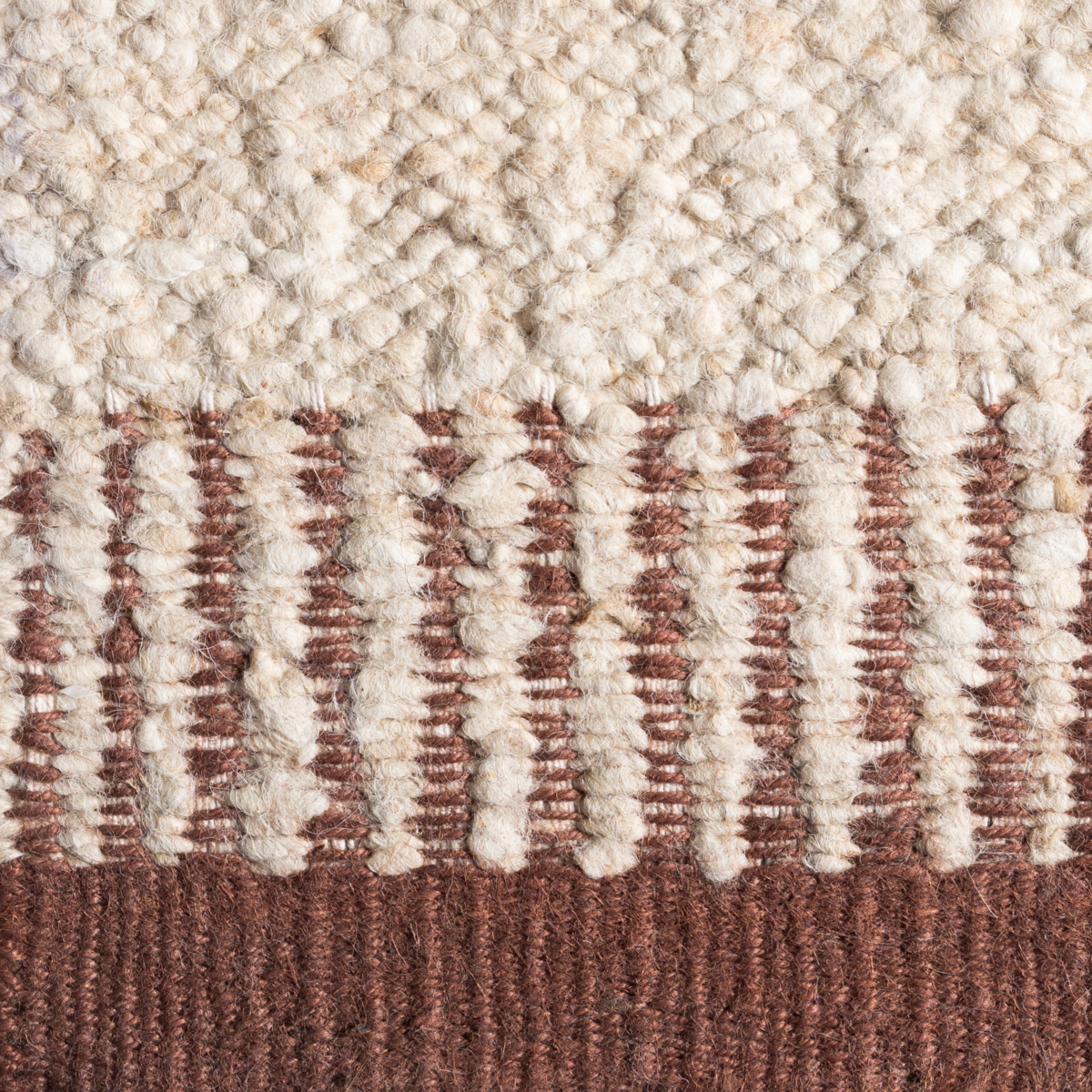 Terra Border : Canyon Anchor close-up showing the wool-jute weave and surface texture