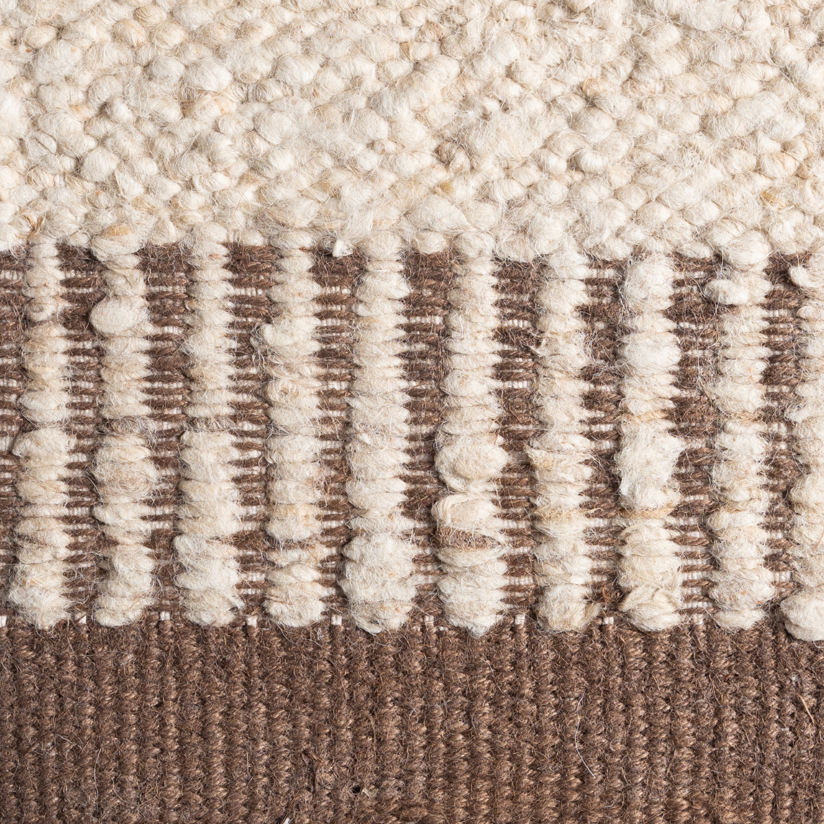 Terra Border : Silt Anchor close-up showing the wool-jute weave and surface texture