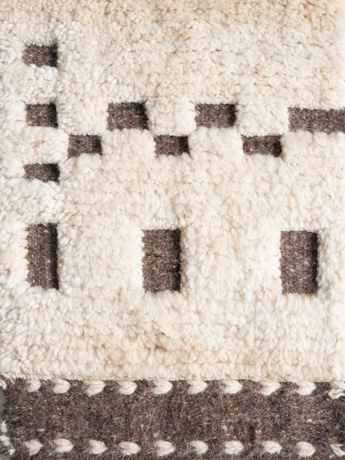 Tethered Landscapes : Basalt Mesa wool rug styled in a living room interior